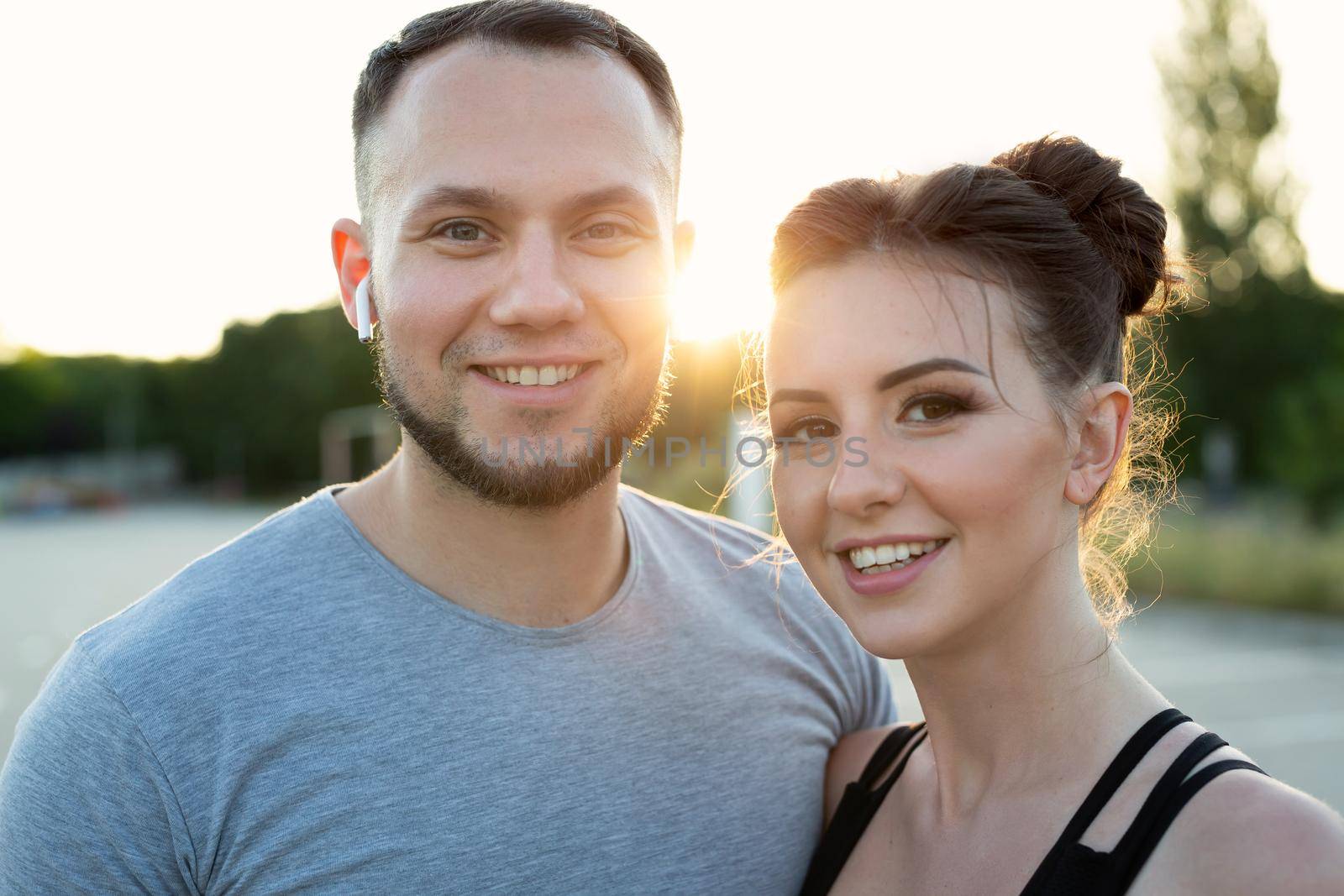 Close-up portrait of young athletes at sunset