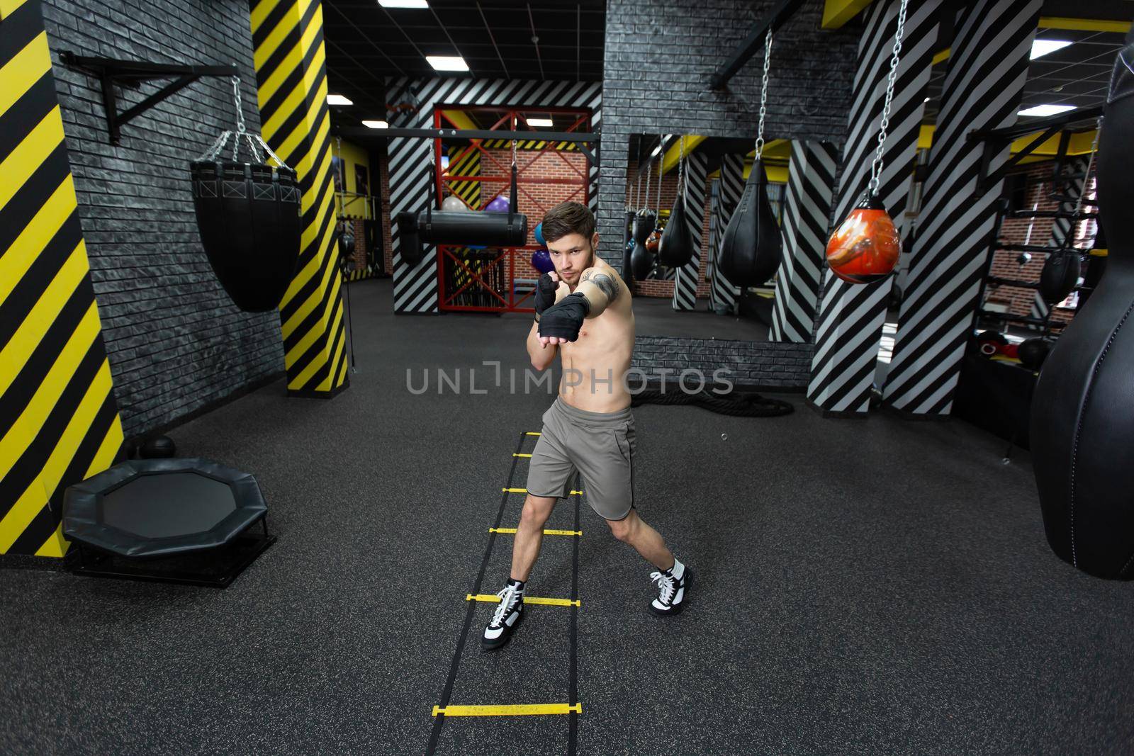 A male athlete trains in the gym.