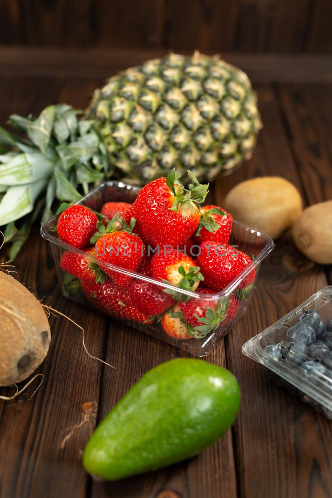 Set of exotic fruits on a wooden background by StudioPeace
