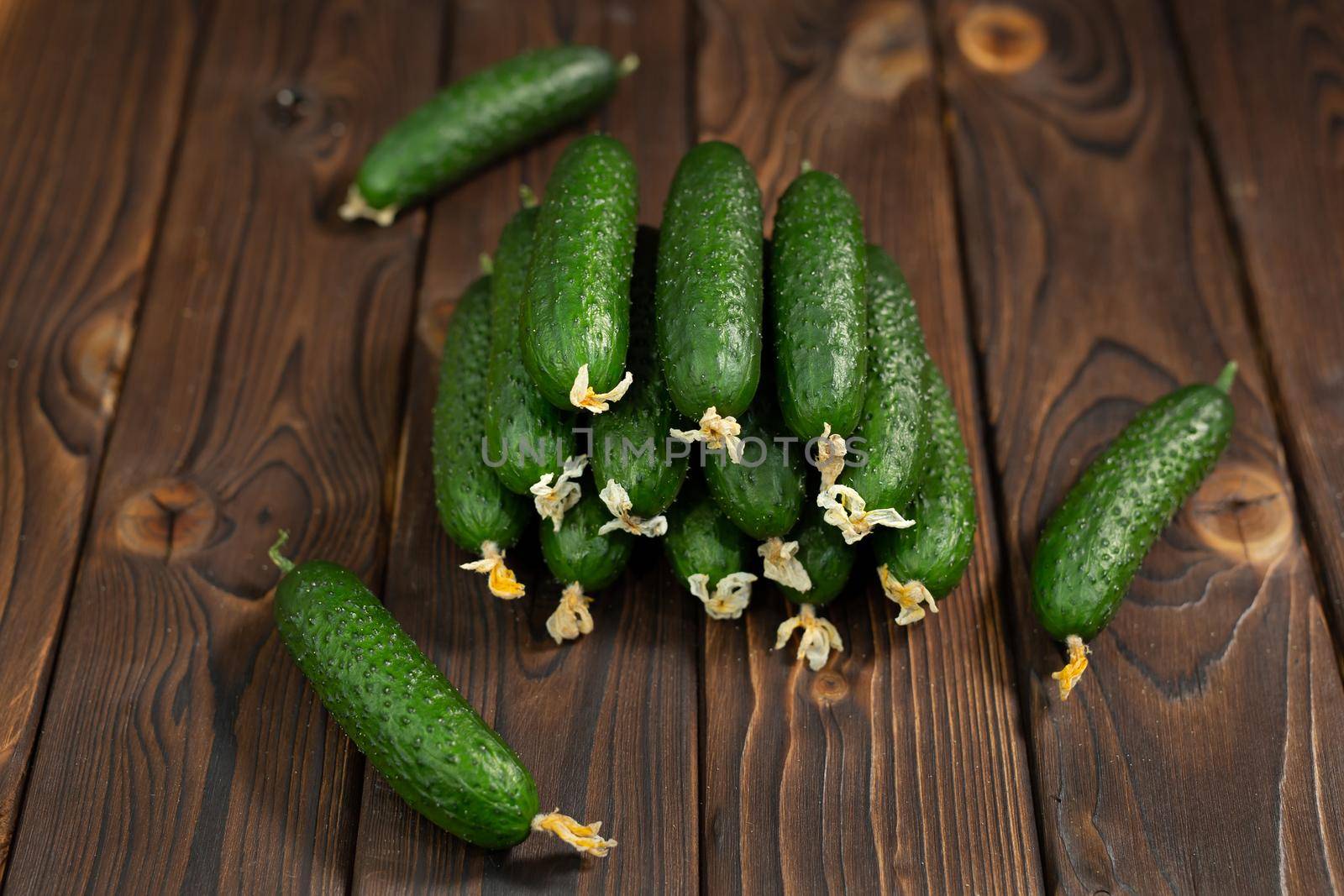Cucumber on brown wood texture background, fresh vegetables. by StudioPeace