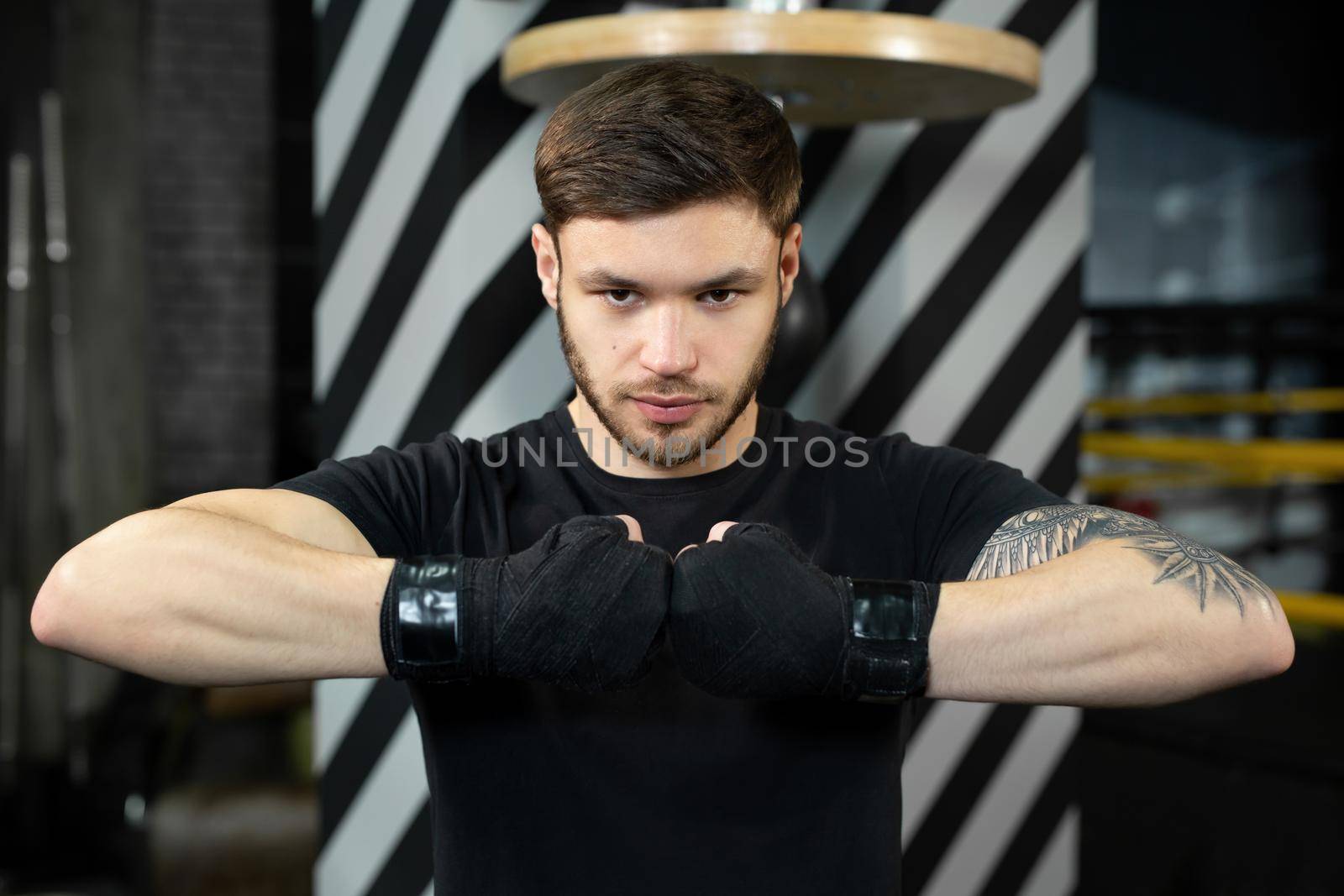 Close-up of the boxer's hand is ready to fight. The concept. Strong hands and clenched fists