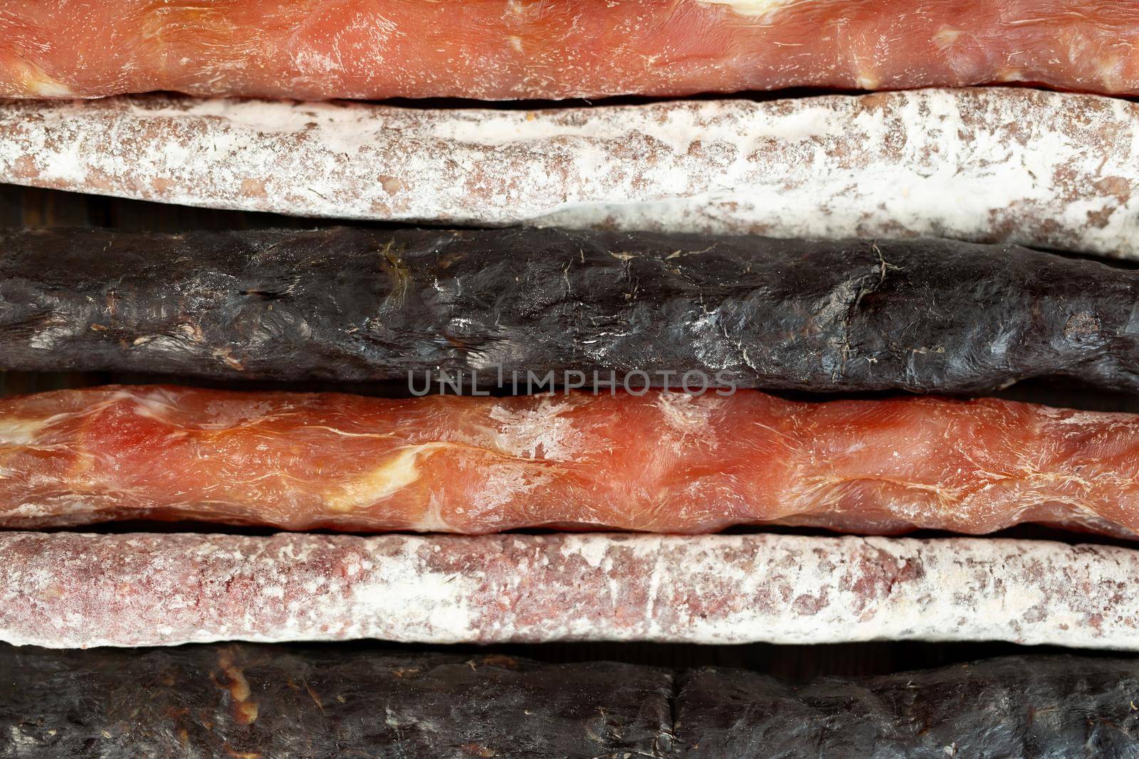 Variety of sausage meat products as a food background. by StudioPeace