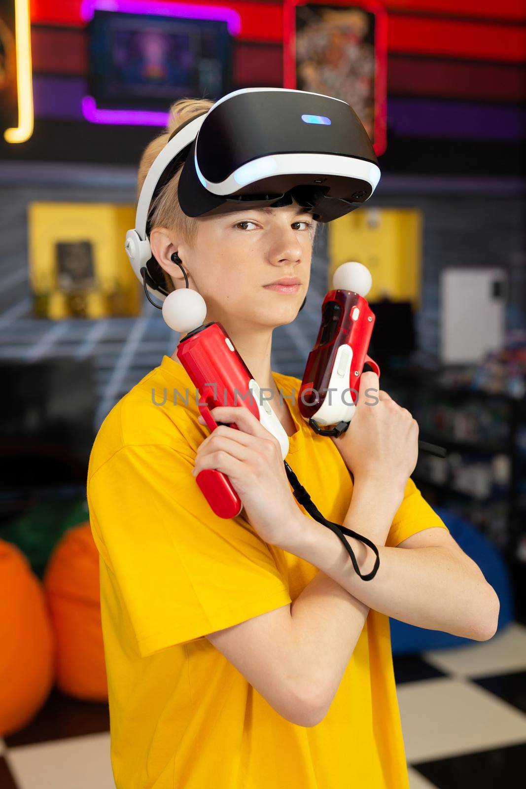 Teen, baby boy playing on a video game console, emotional gamer shooting a game using a gun controller in a game club. VR. by StudioPeace