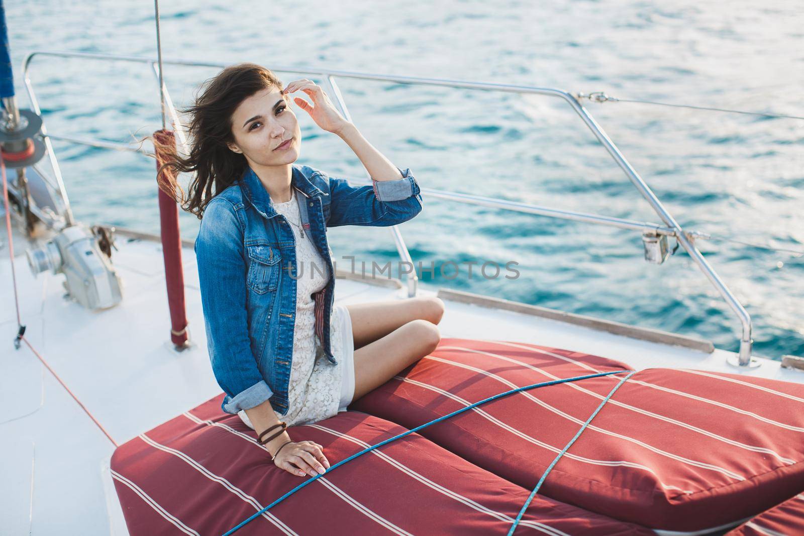Attractive girl on a yacht at sea