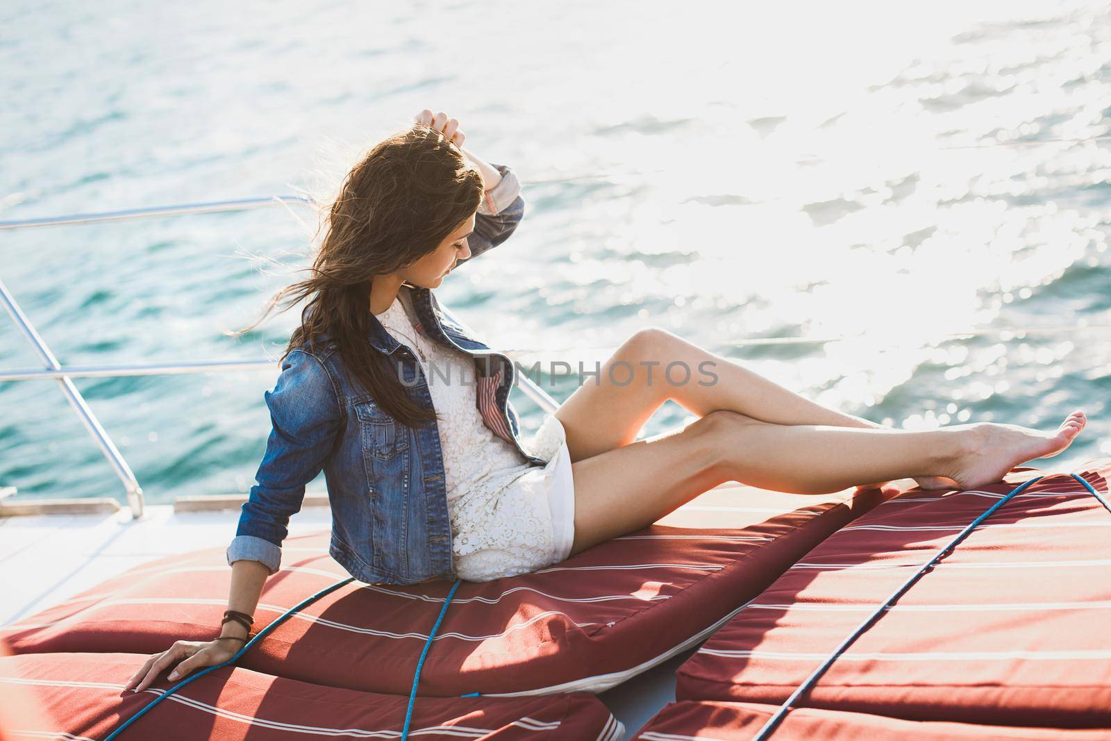 Attractive girl on a yacht at sea