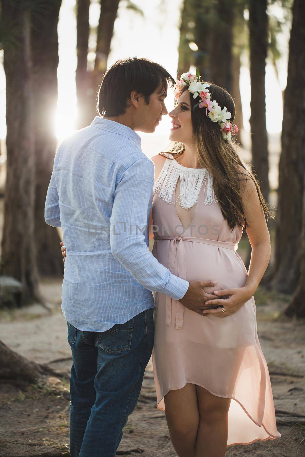 Young attractive couple: pregnant mother and happy father. by StudioPeace