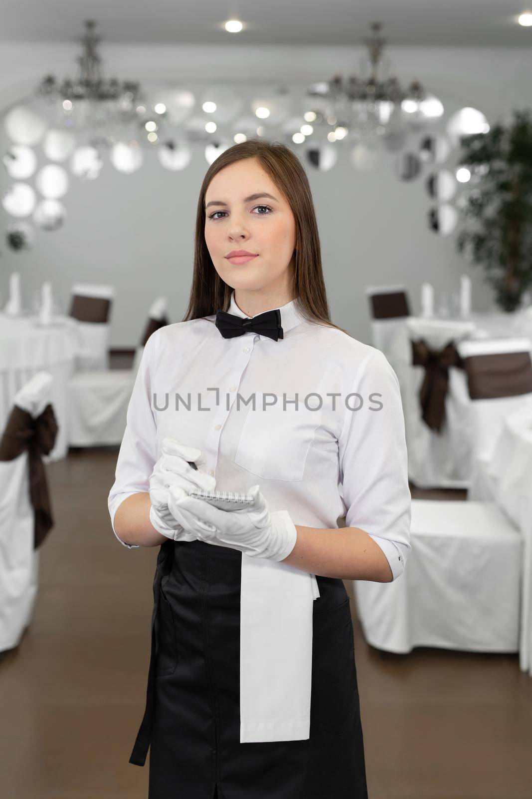 Waiter writing an order into a notebook