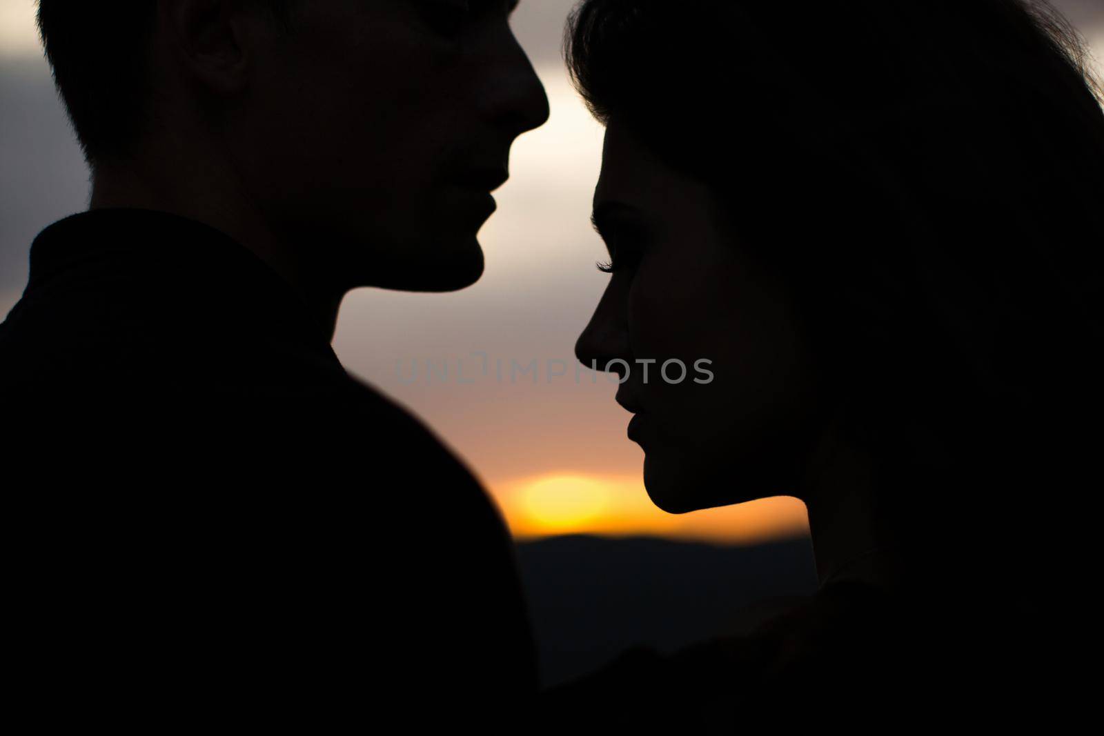 Silhouette sweethearts at sunset