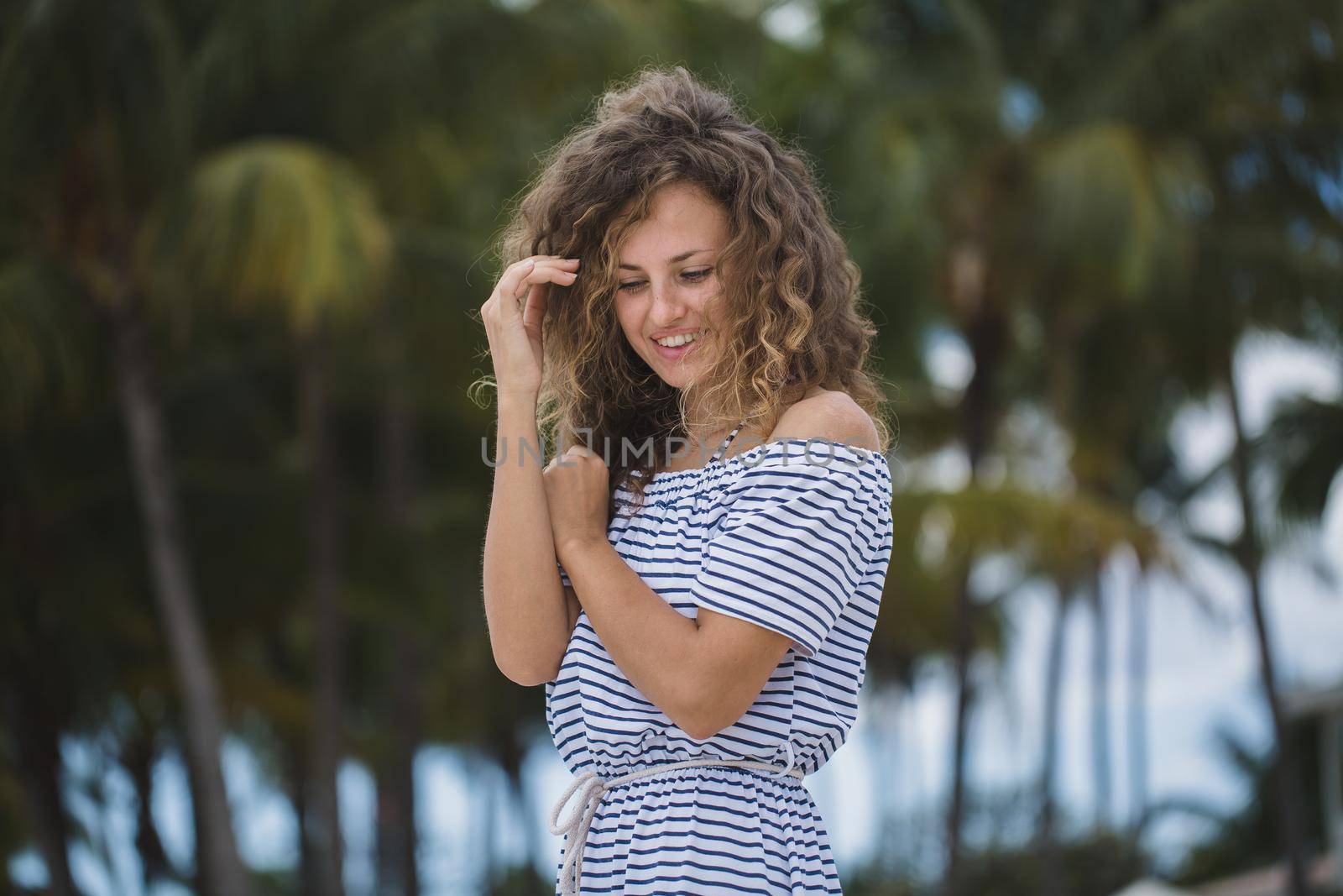 Beautiful girl on a background of palm trees. by StudioPeace