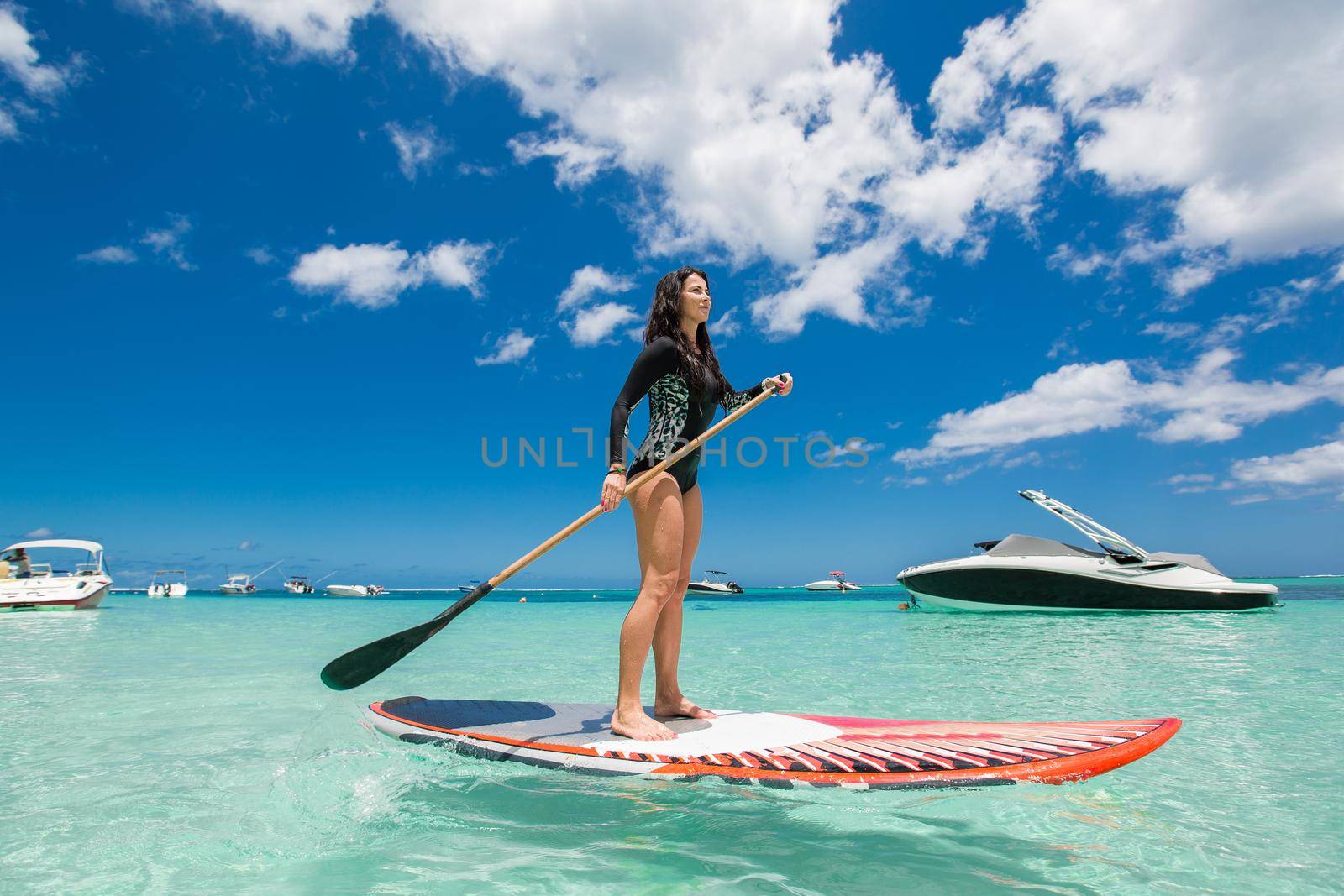 Beautiful woman has surfing in a beautiful sunny day. by StudioPeace