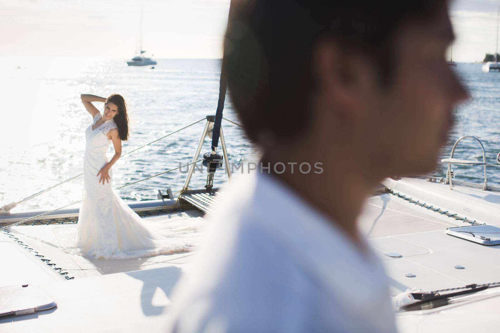 Just married couple on yacht. Happy bride and groom