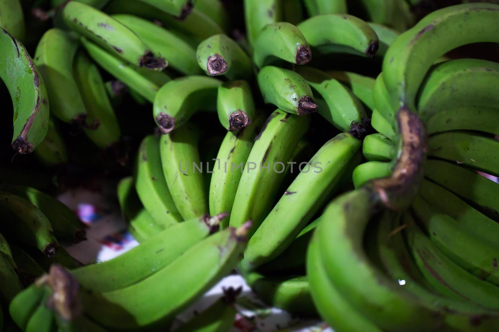 Green bananas in the Indian market in Mauritius by StudioPeace