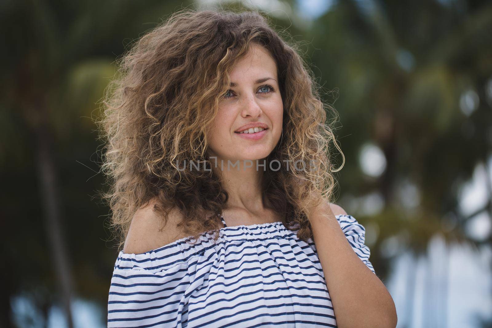 Beautiful girl on a background of palm trees. by StudioPeace