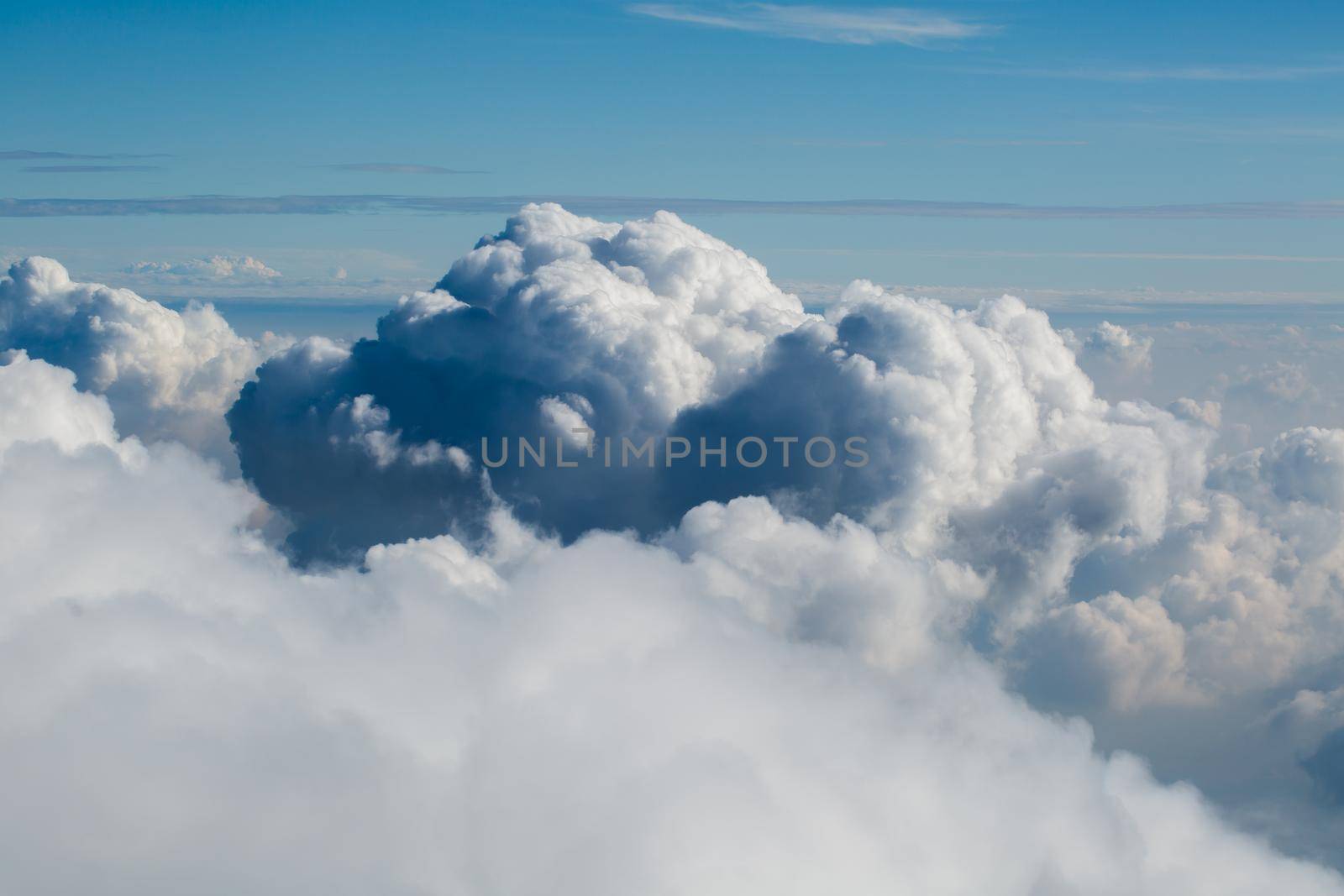 Beautiful blue clouds from the plane window. by StudioPeace