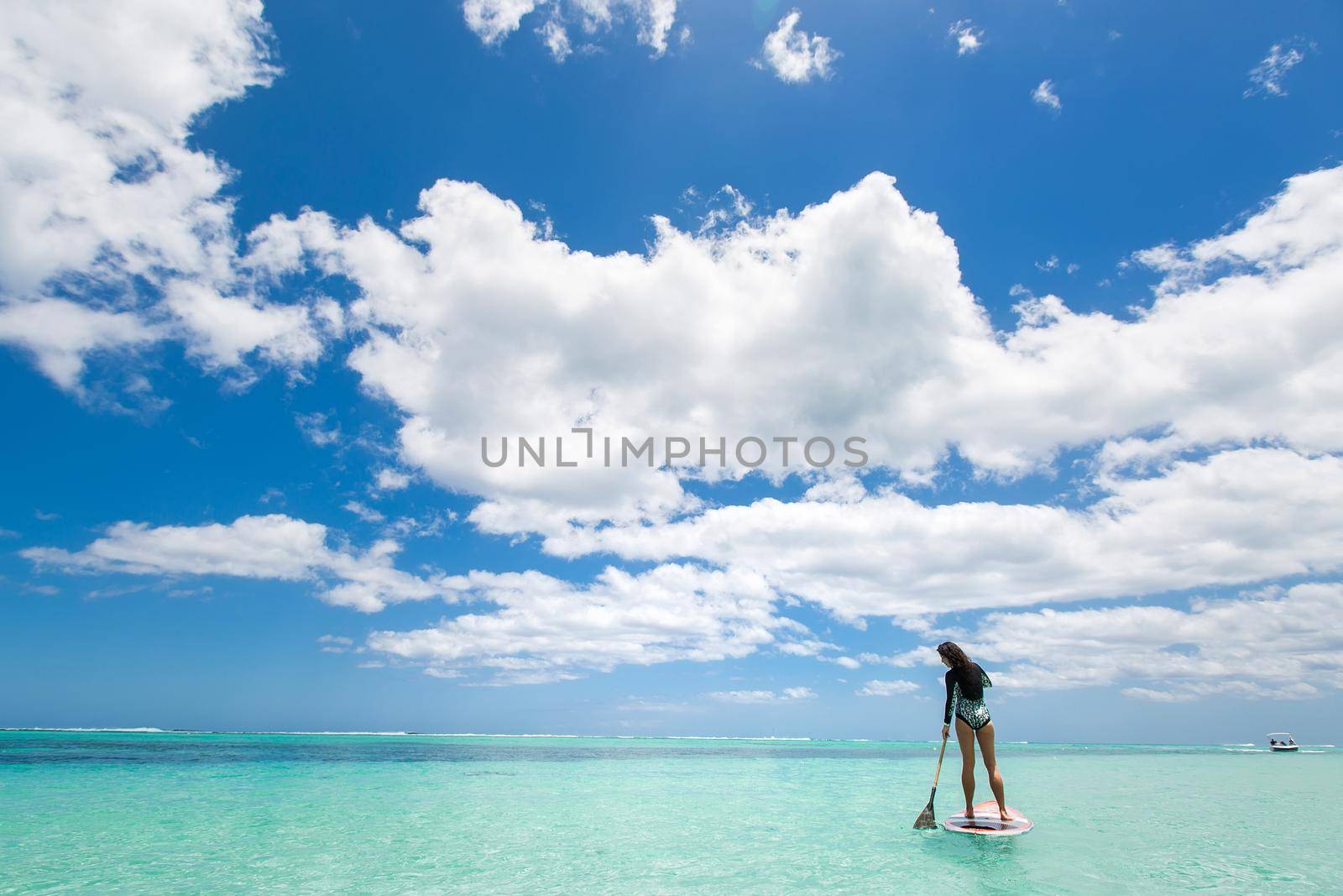 Beautiful woman has surfing in a beautiful sunny day