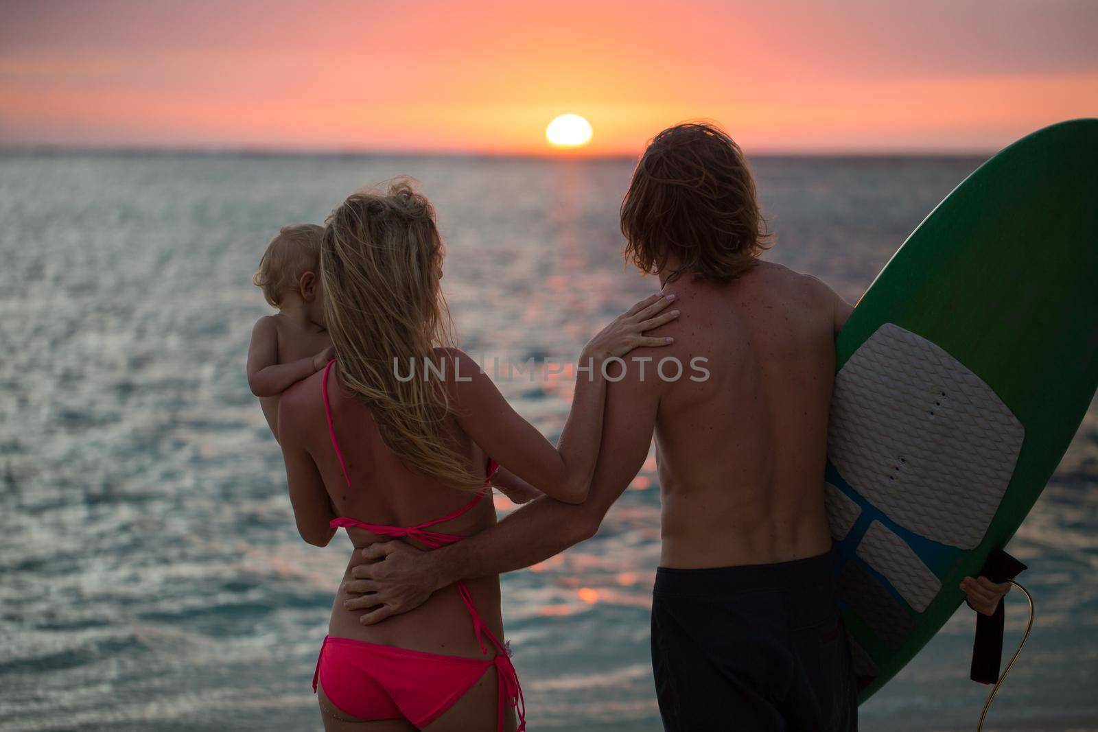 Silhouette of a happy family at sunset. by StudioPeace