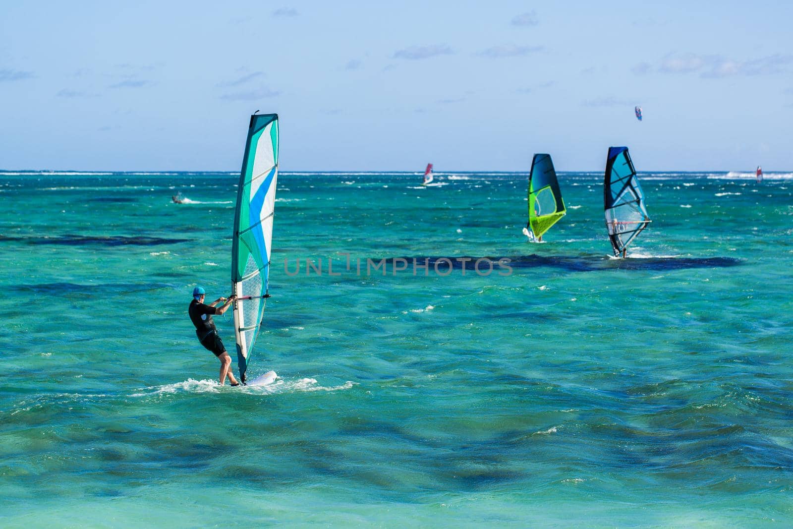 Windsurfers on the Le Morne beach in Mauritius. by StudioPeace