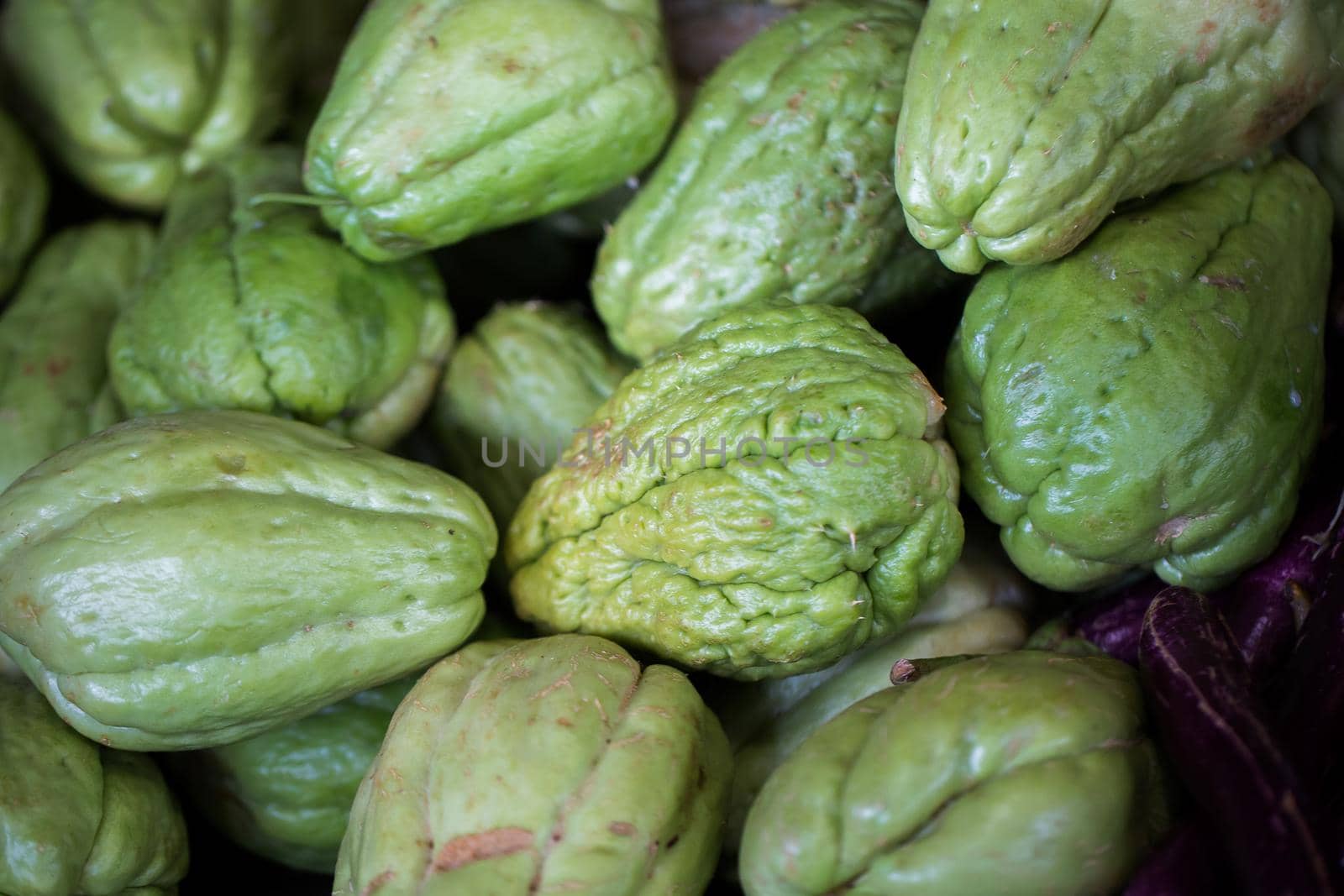Fresh vegetables Chayote. Chuchu in the Indian market in Mauritius by StudioPeace