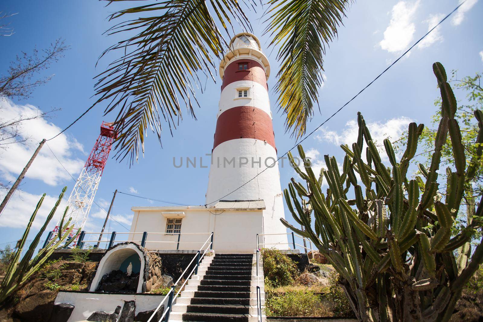 Lighthouse on blue sky background on Mauritius.