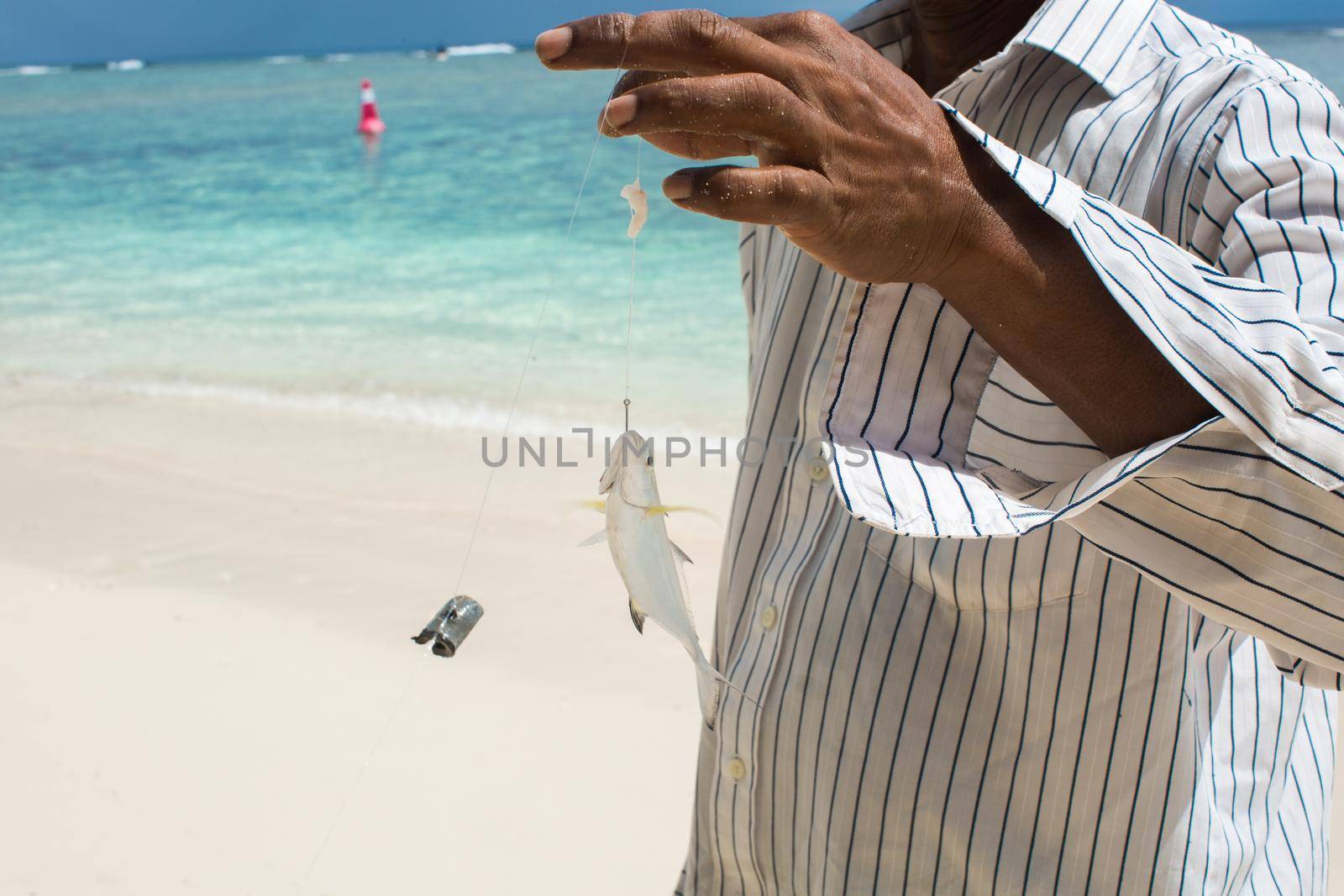 Fishing on the beach on the ocean.