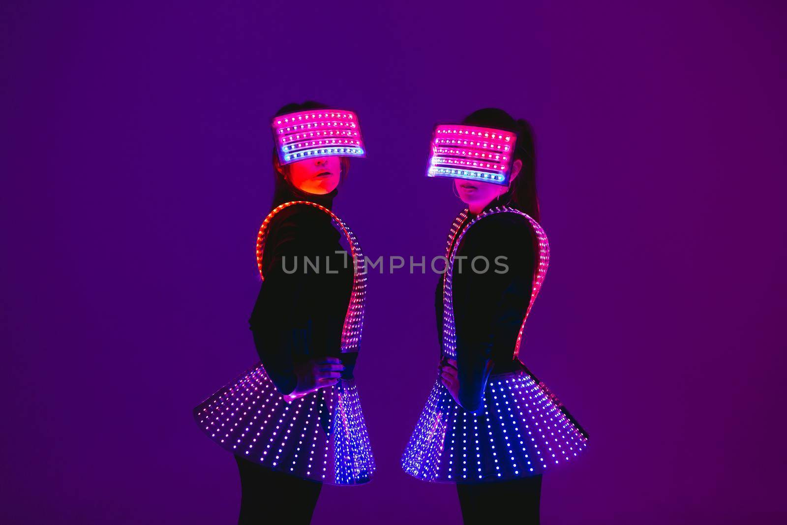 Two disco dancers move in UV costumes by StudioPeace