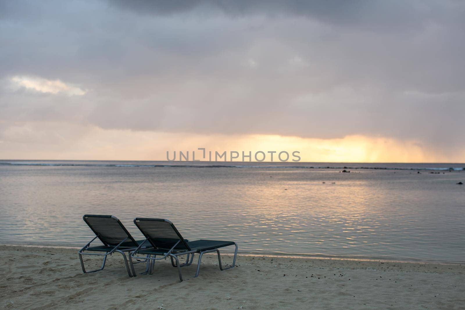 beach chair on the beach with sunset. by StudioPeace