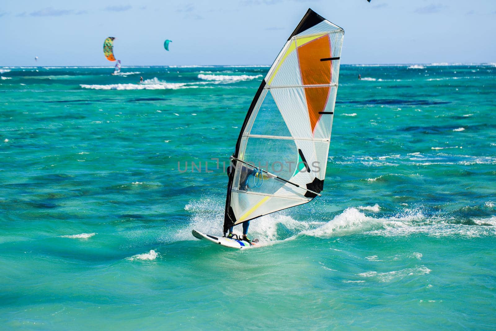 Windsurfers on the Le Morne beach in Mauritius. by StudioPeace