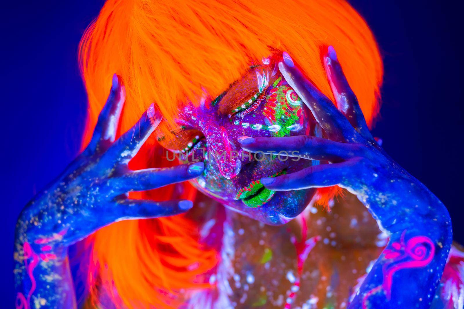 Neon Woman dancing. Fashion model woman in neon light, portrait of beautiful model with fluorescent make-up, Art design of female disco dancer posing in UV, colorful make up. by StudioPeace