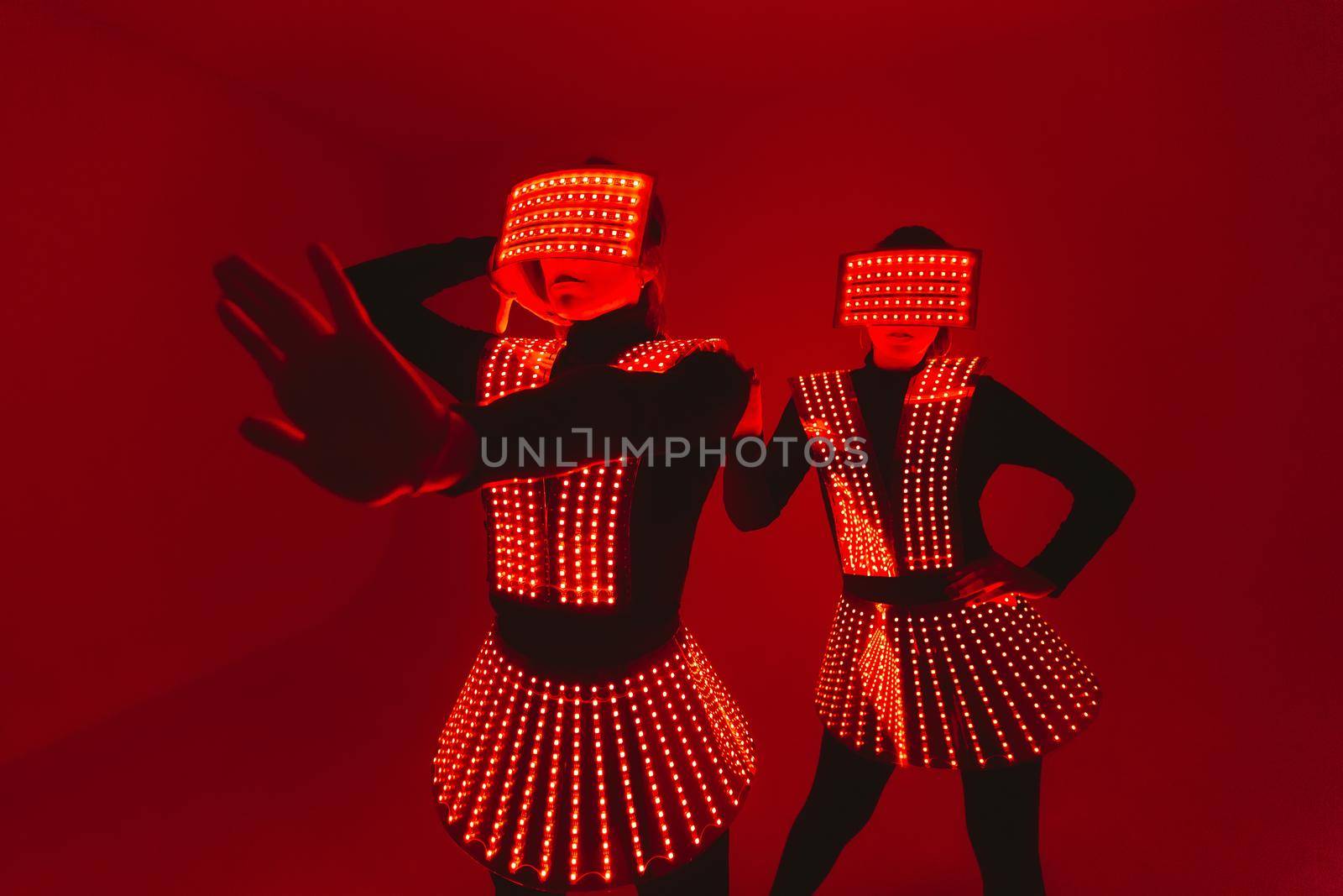 Two disco dancers move in UV costumes by StudioPeace