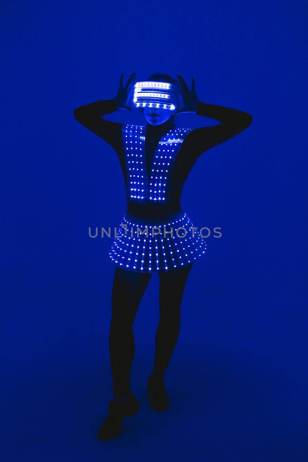 Disco dancer moves in UV ultraviolet suit