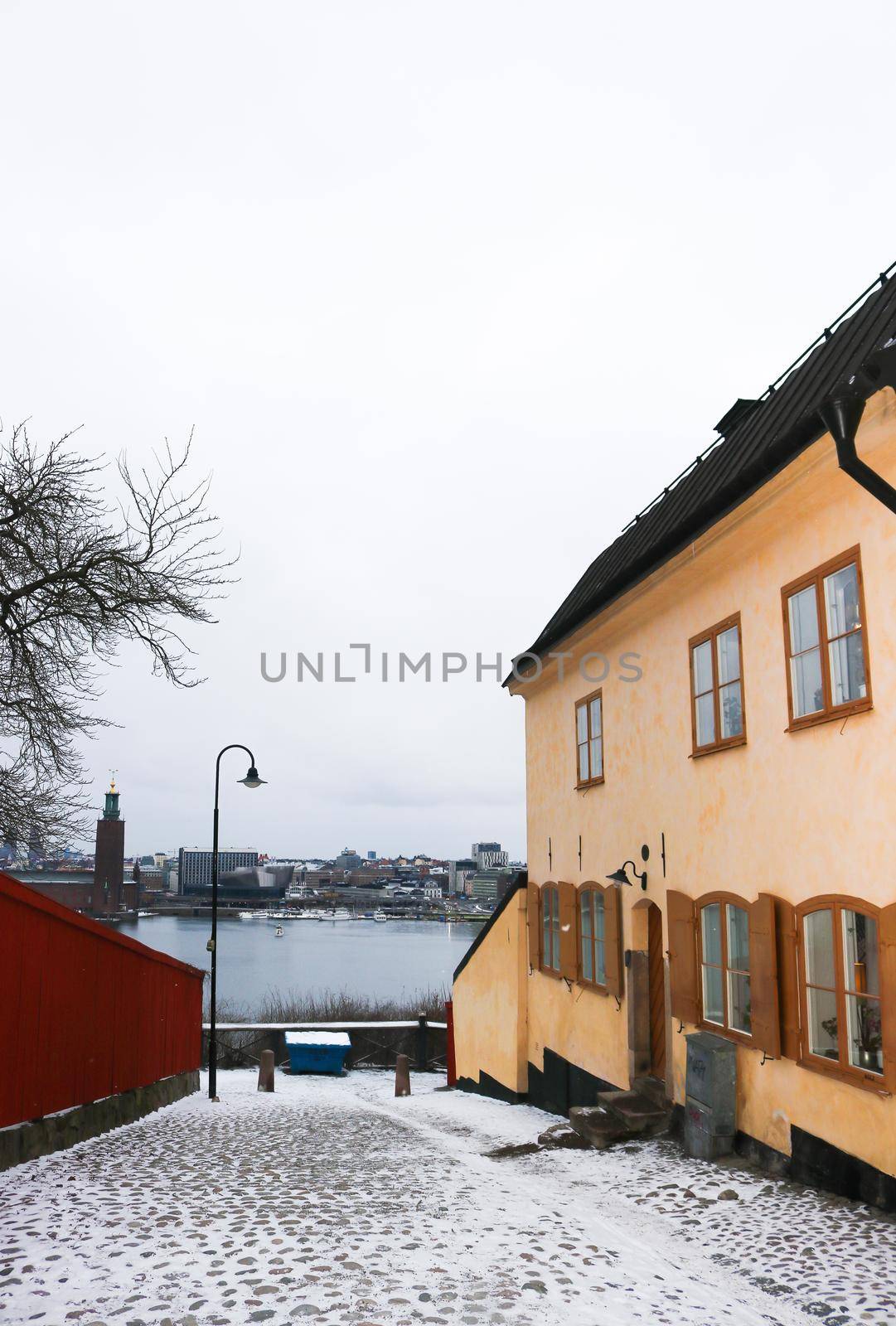 View of Stockholm city from a snowy street in Sodermalm, Sweden. by olifrenchphoto