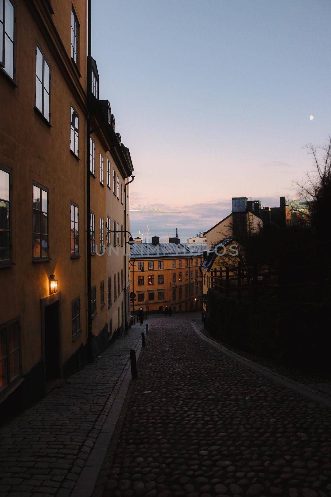 Traditional Swedish backstreet at sunset, on the island of Sodermalm, south Stockholm city, Sweden. High quality photo.