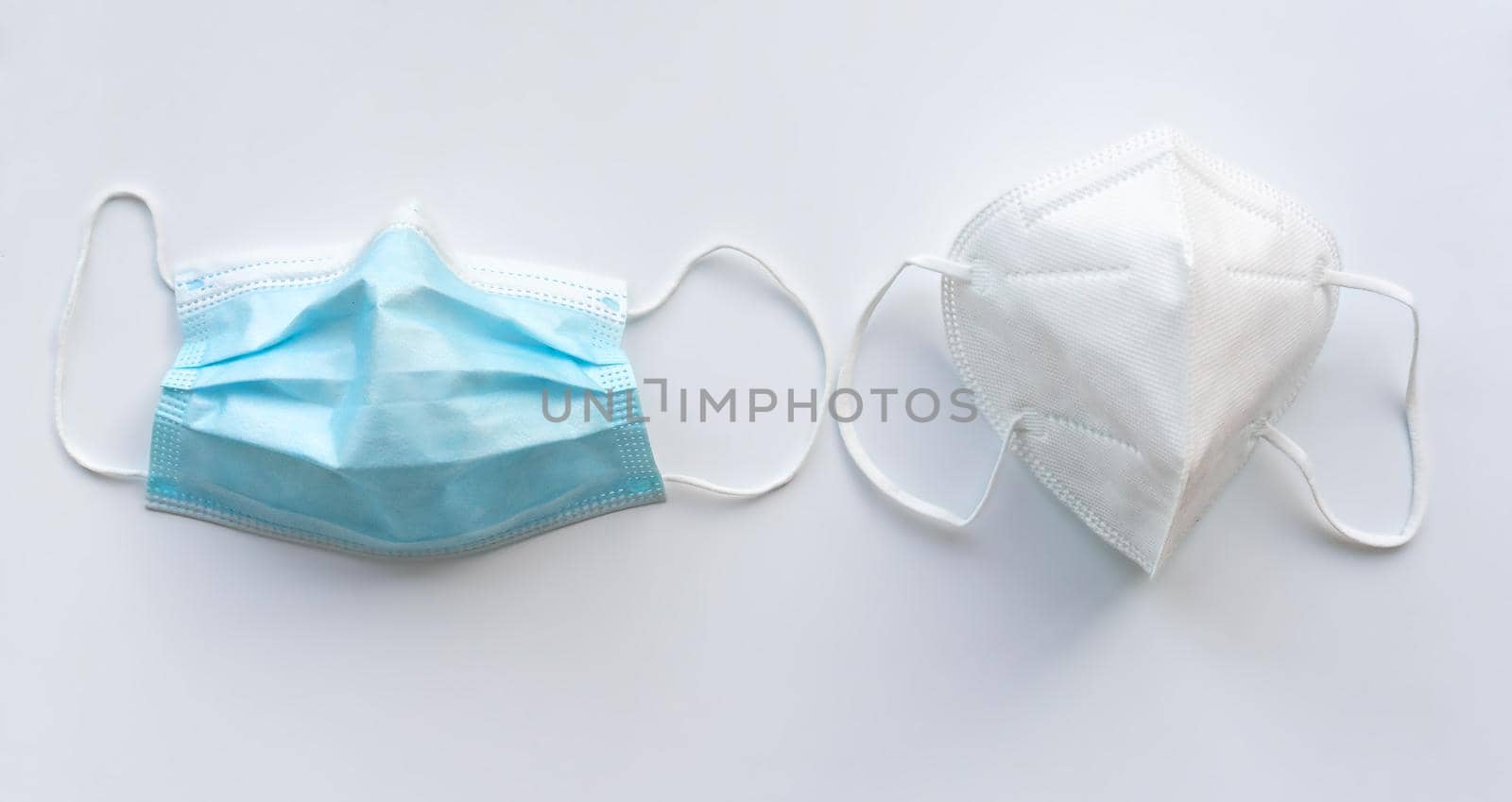 Viruses and bacteria protection masks isolated on white background. Surgical mask and ffp2 mask.