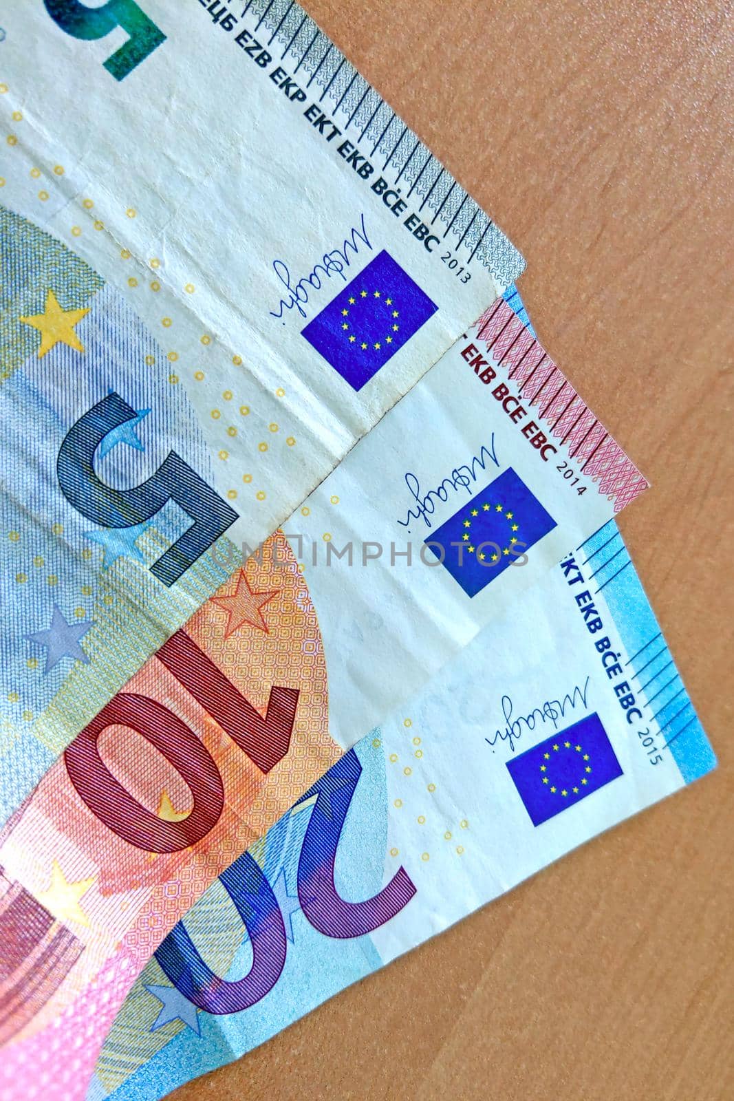 Euro banknotes of various denominations on the table. by kip02kas