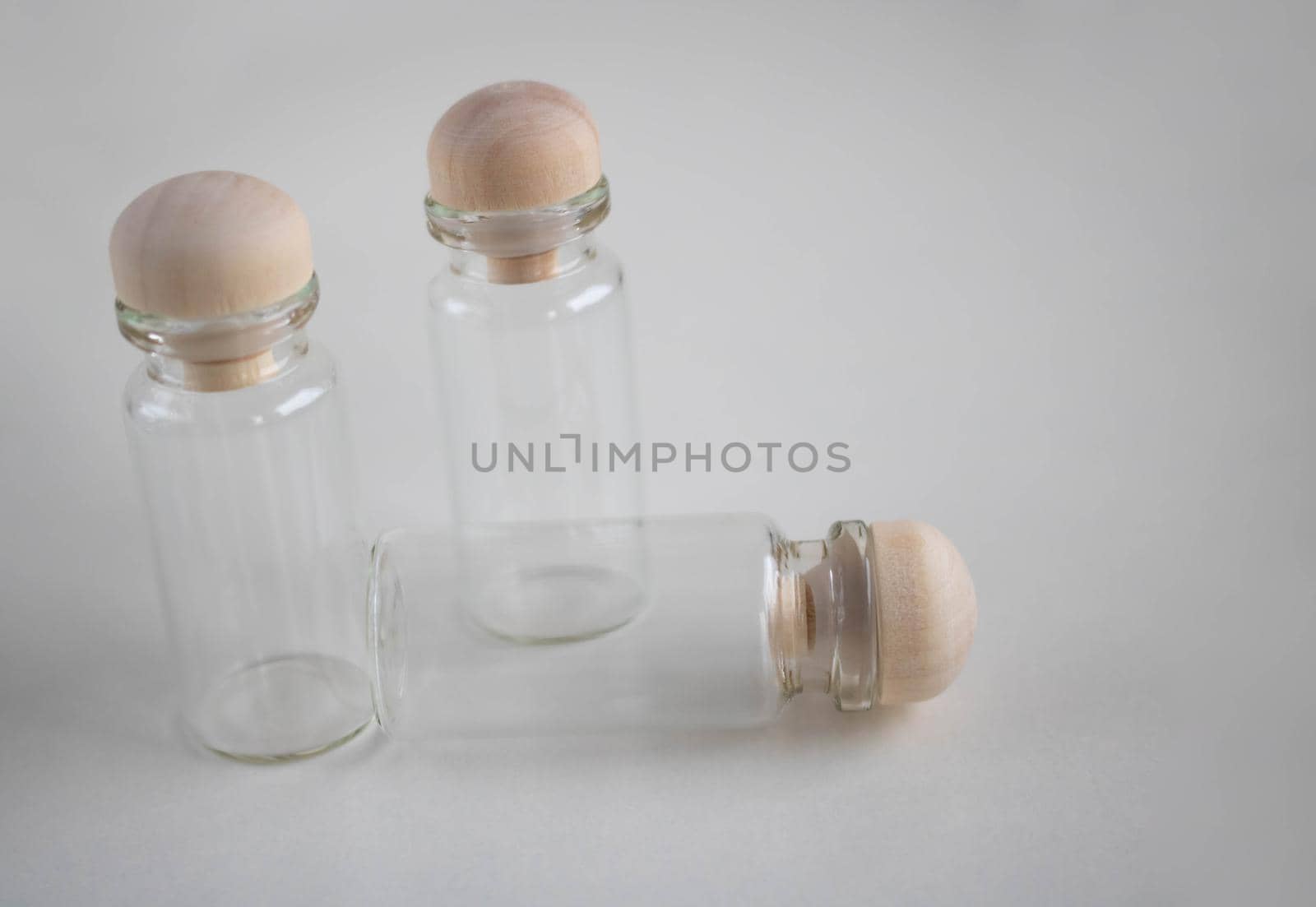 Empty bottles with wooden stoppers for storage. Place for your text by lapushka62