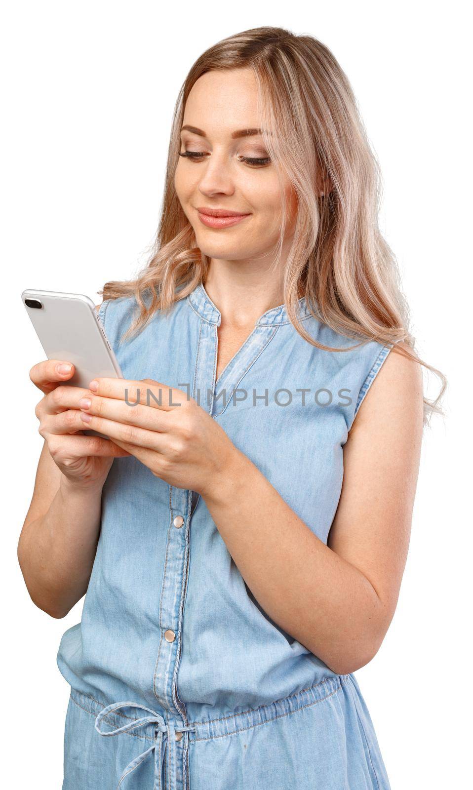 Portrait of a smiling casual woman holding smartphone over white background, close up