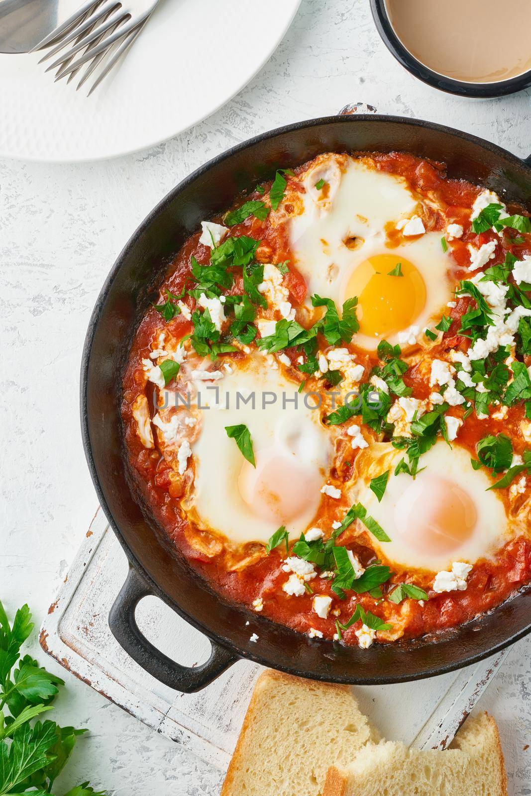 Shakshouka, eggs poached in sauce of tomatoes, olive oil, peppers, onion and garlic, Mediterranean cousine. Keto meal, FODMAP recipe, low carb