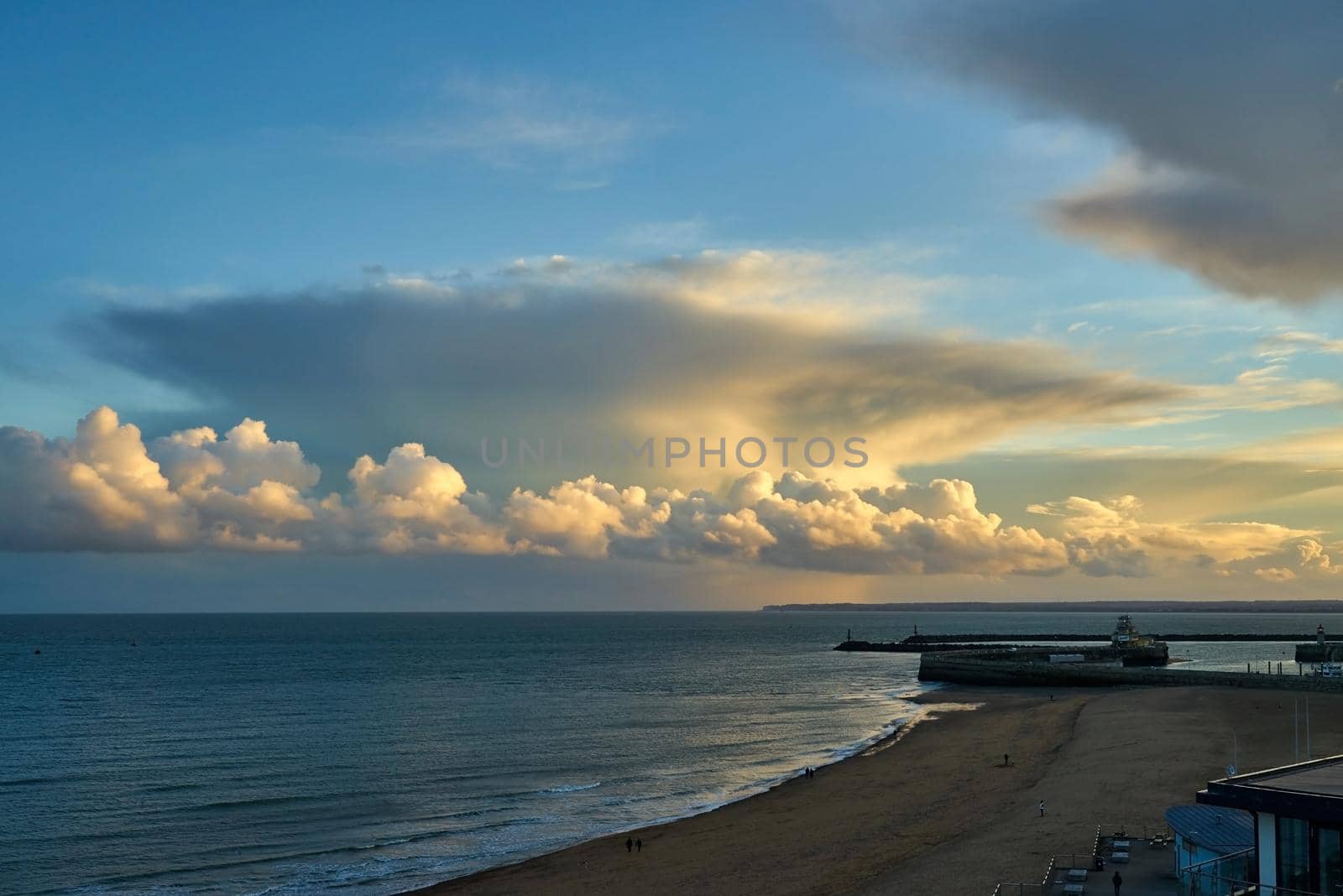 Ramsgate main sands and harbour entrance with cumulonimbus clouds in the distance.