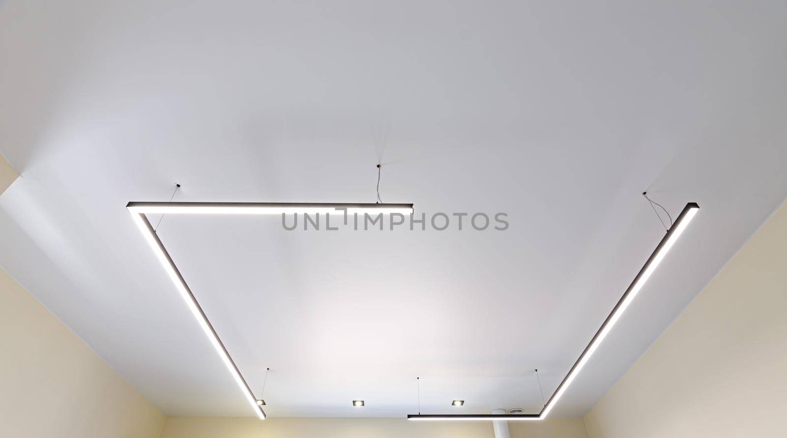 Modern white matte stretch ceiling with original fixtures by Madhourse