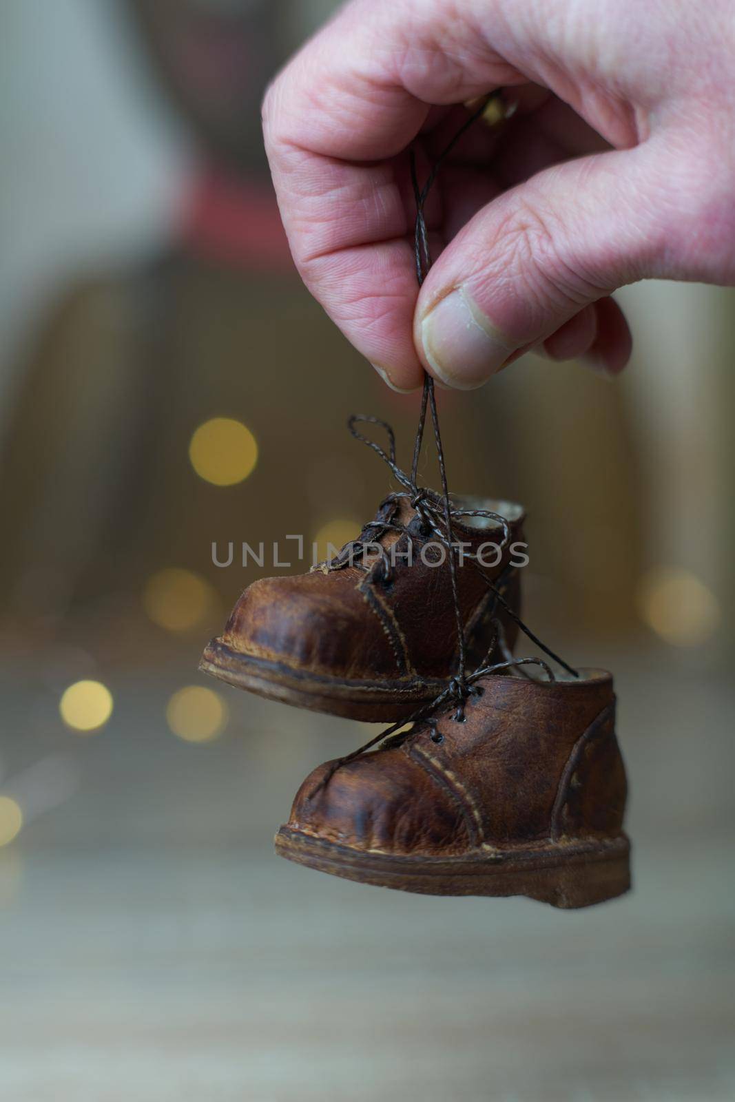 the concept of light industry for the manufacture of stylish fashionable brown leather small shoes with small feet for teddy bears or dolls and for children and their parents by Costin