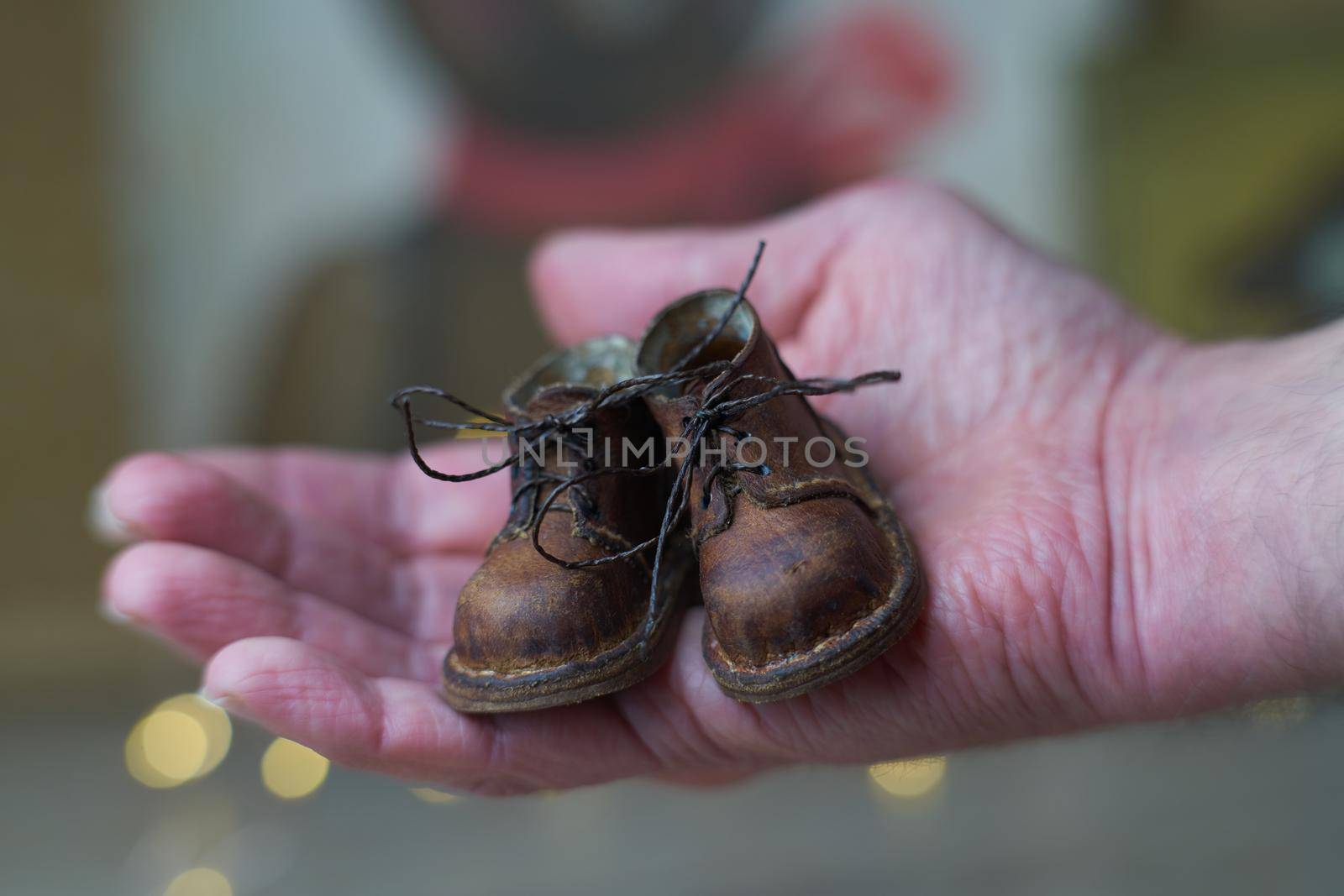 the concept of light industry for the manufacture of stylish fashionable brown leather small shoes with small feet for teddy bears or dolls and for children and their parents by Costin