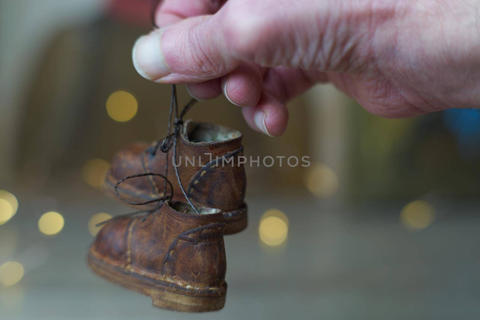 the concept of light industry for the manufacture of stylish fashionable brown leather small shoes with small feet for teddy bears or dolls and for children and their parents by Costin