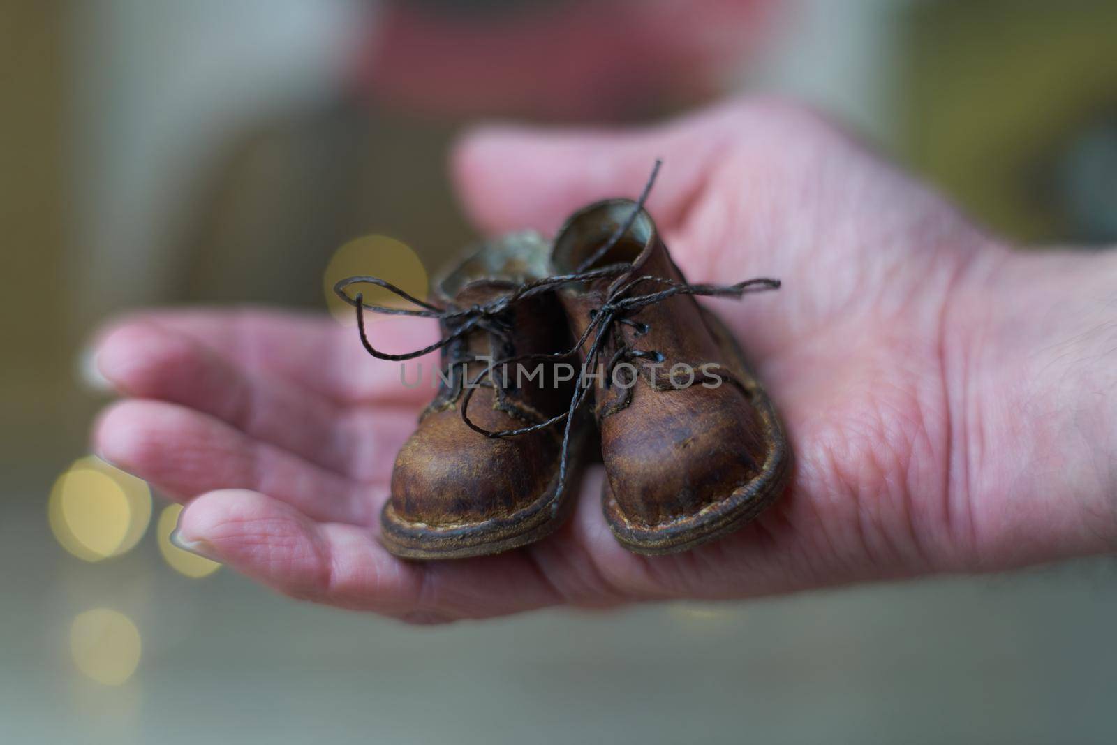 the concept of light industry for the manufacture of stylish fashionable brown leather small shoes with small feet for teddy bears or dolls and for children and their parents by Costin