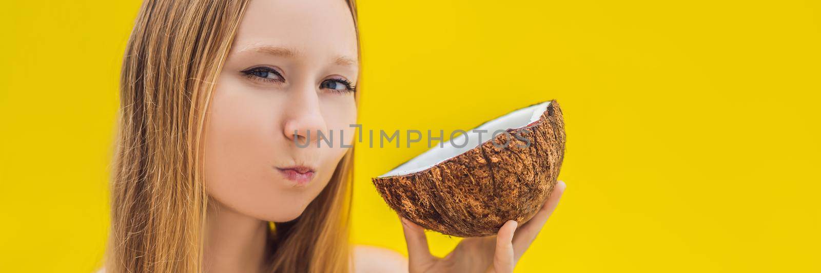 Young woman doing oil pulling over yellow background BANNER, LONG FORMAT by galitskaya