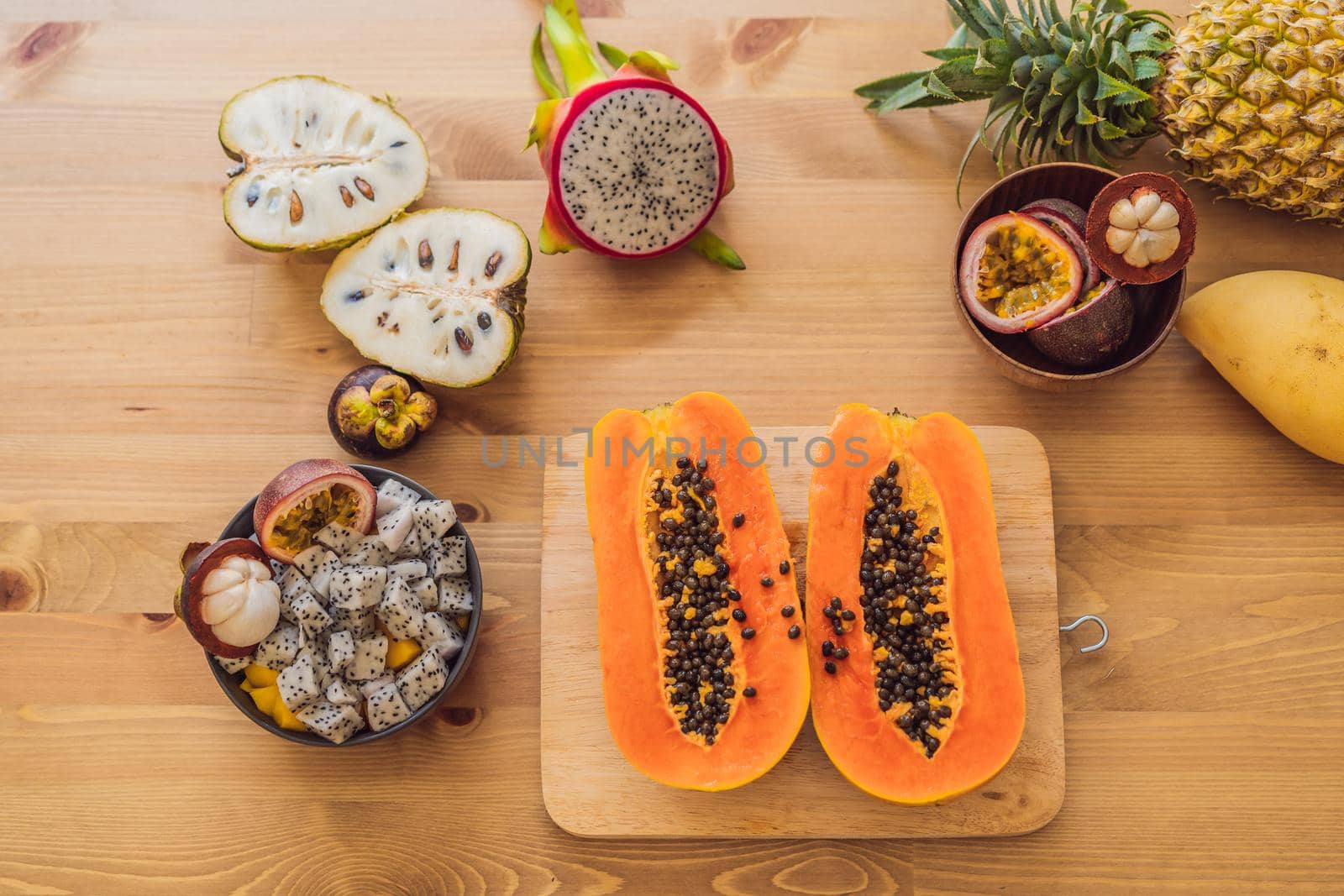 Healthy eating background of different fruits on old wooden table by galitskaya