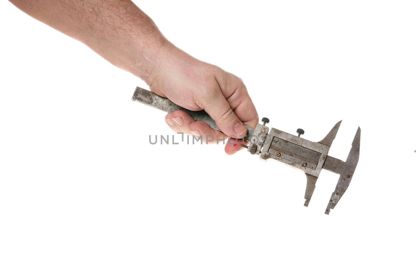 Hand holds an old caliper on a cord on a white background by vizland
