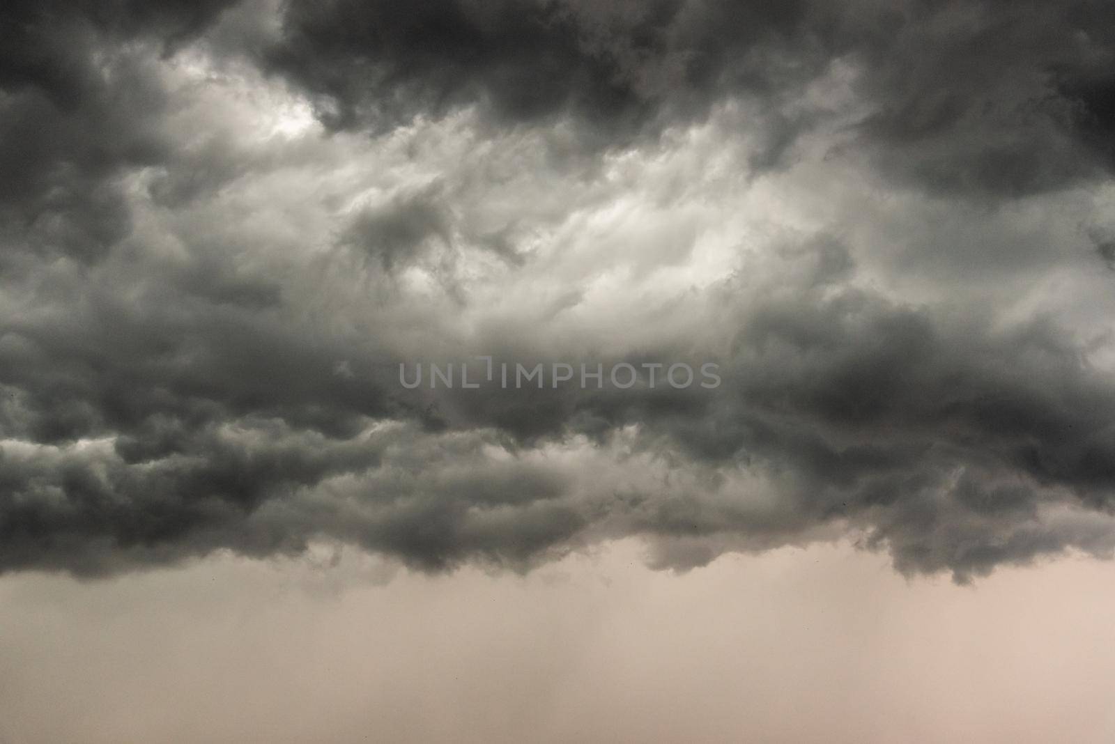 Gloomy clouds have shrouded sky before a thunderstorm.