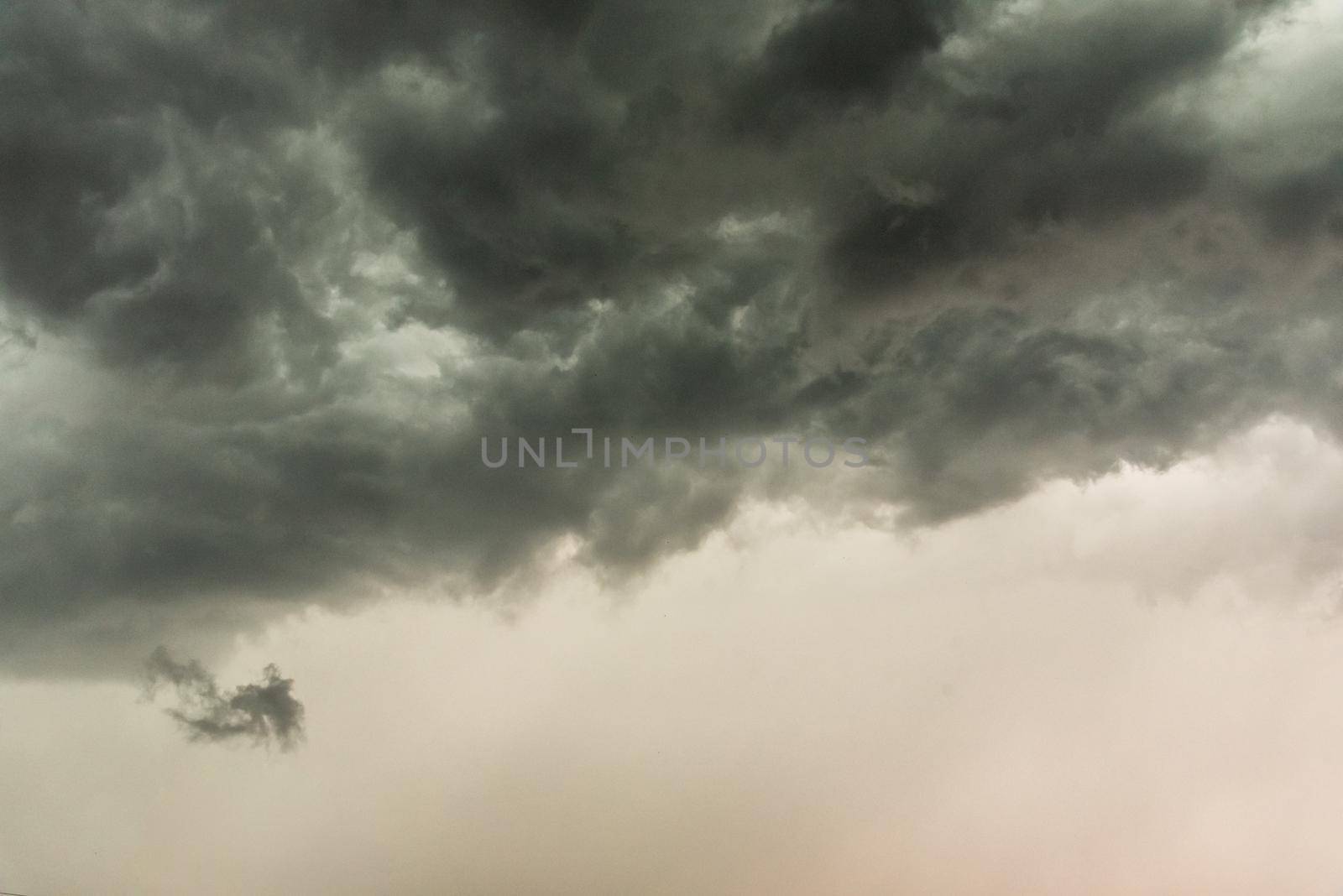 Gloomy clouds have shrouded sky before a thunderstorm.