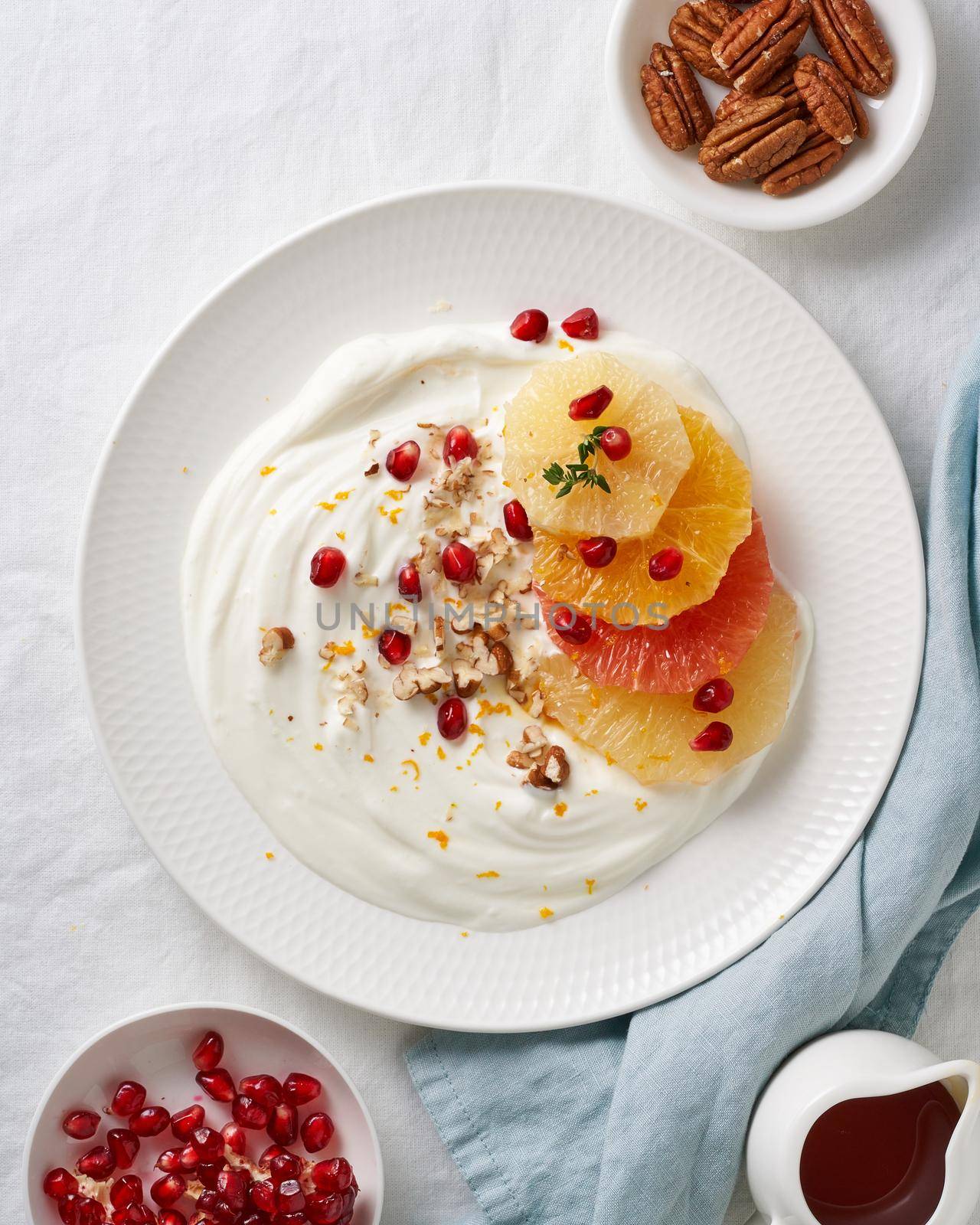 Ricotta with citrus fruits, pecans. Mixed salad with coconut yoghurt. Sweet colorful dessert by NataBene