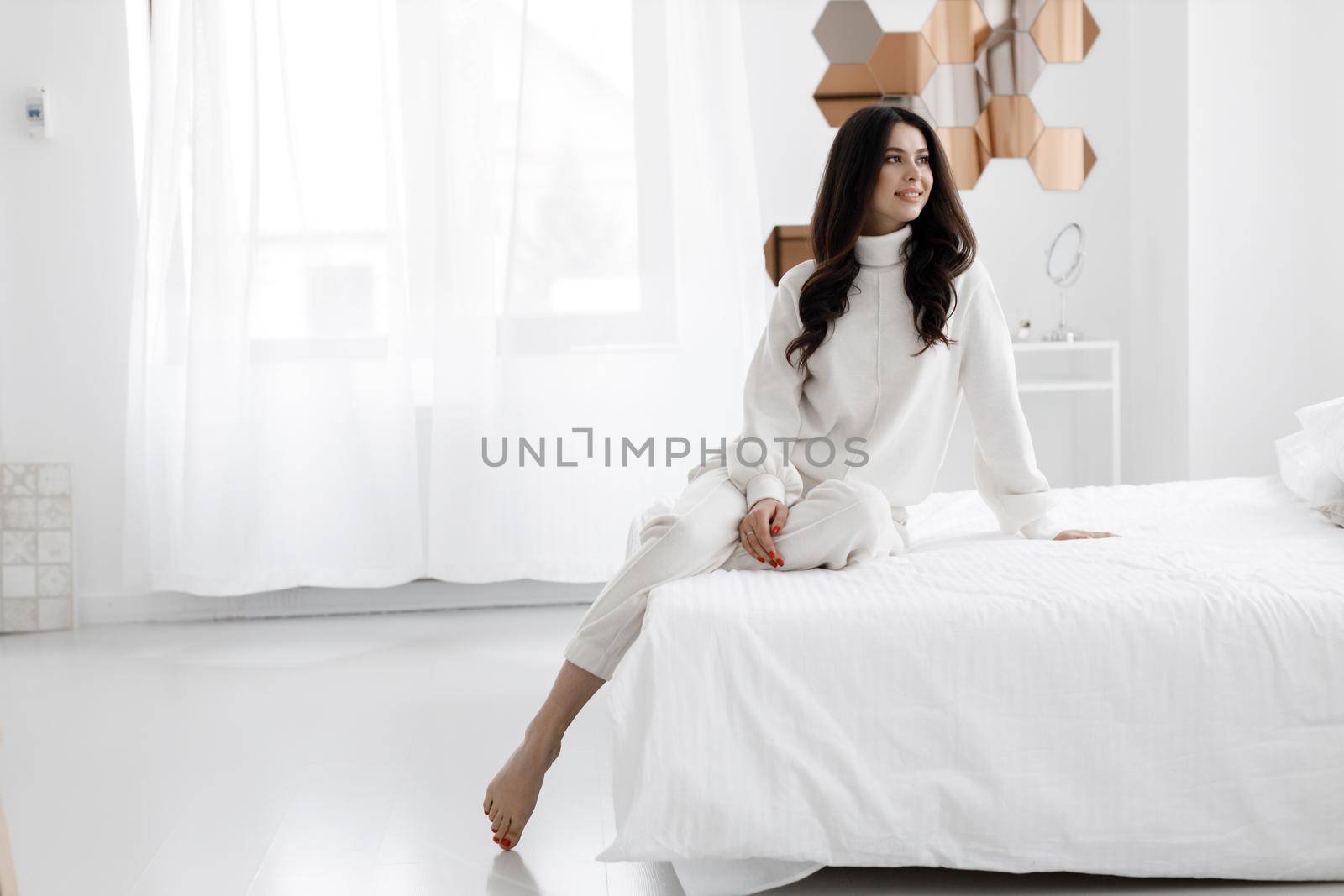 Young happy woman portrait indoor at by splash